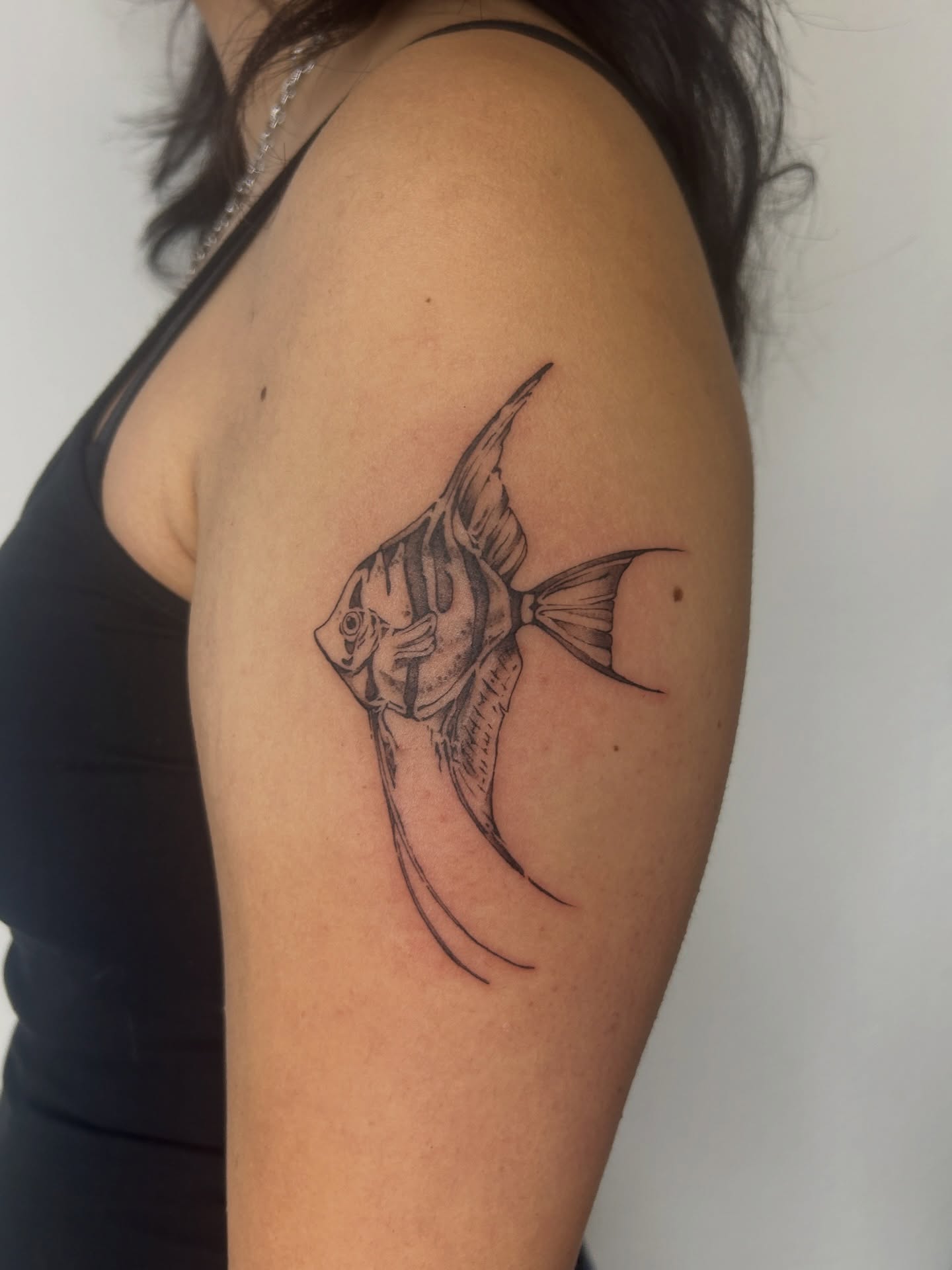 Angelfish black and grey tattoo on the shoulder by Miri