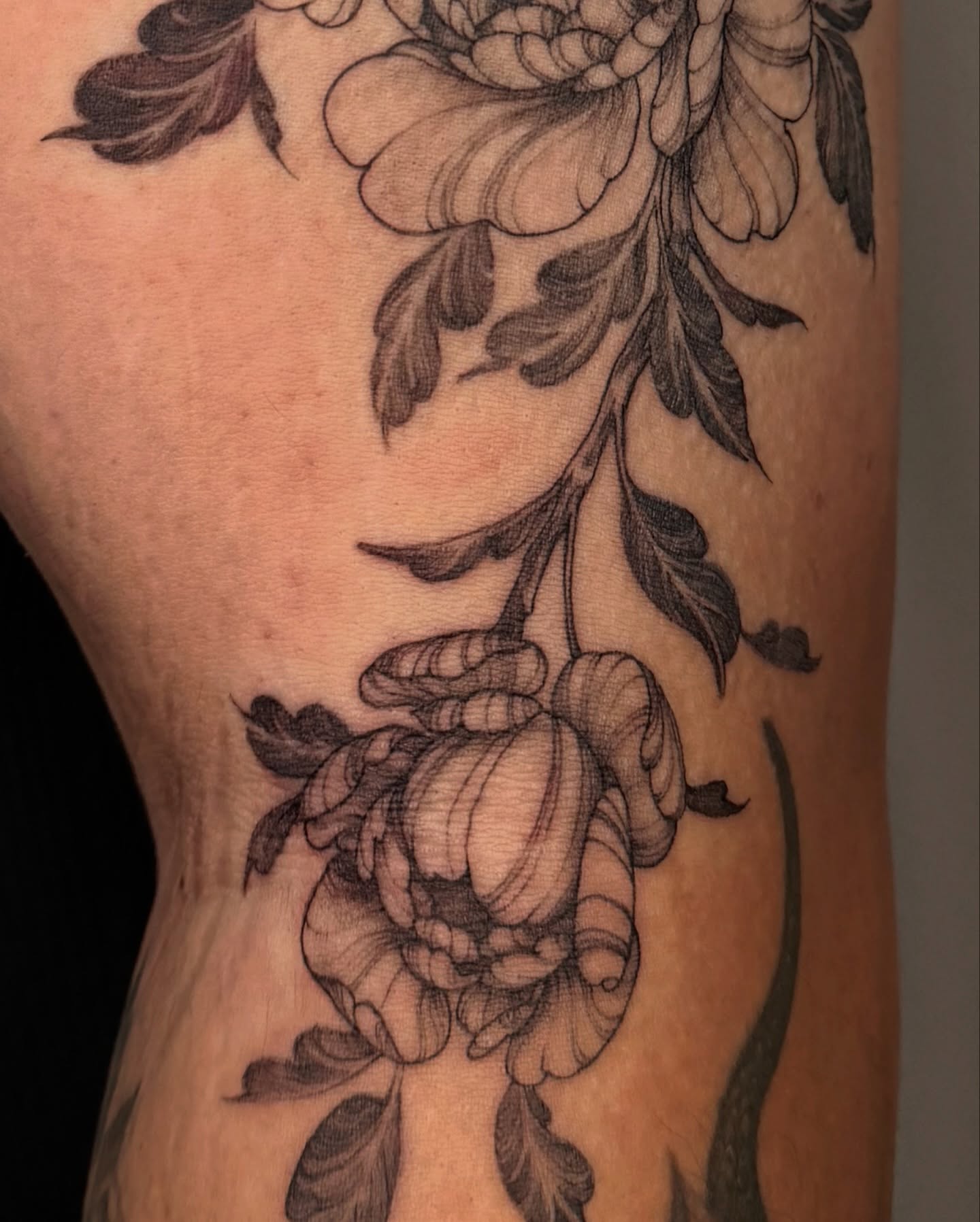 Peony flowers black and grey tattoo on the forearm by Sab