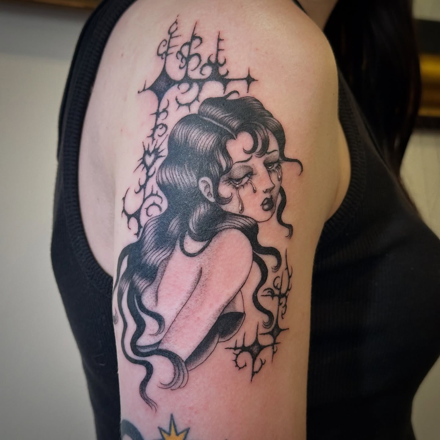 Weeping woman dark realism tattoo on the shoulder by Bree Lin