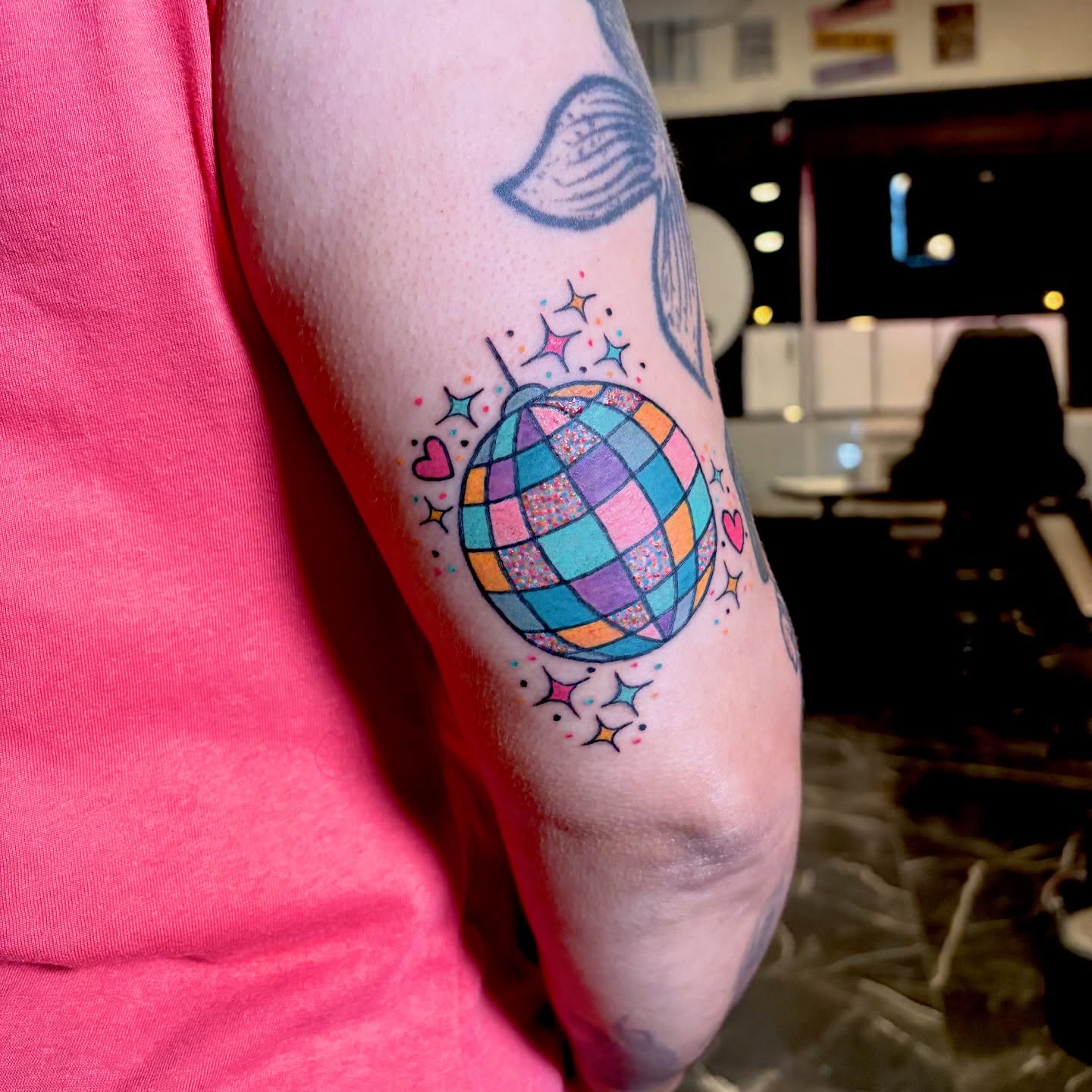 Disco ball geometric tattoo on the forearm by Barbara Gonzalez