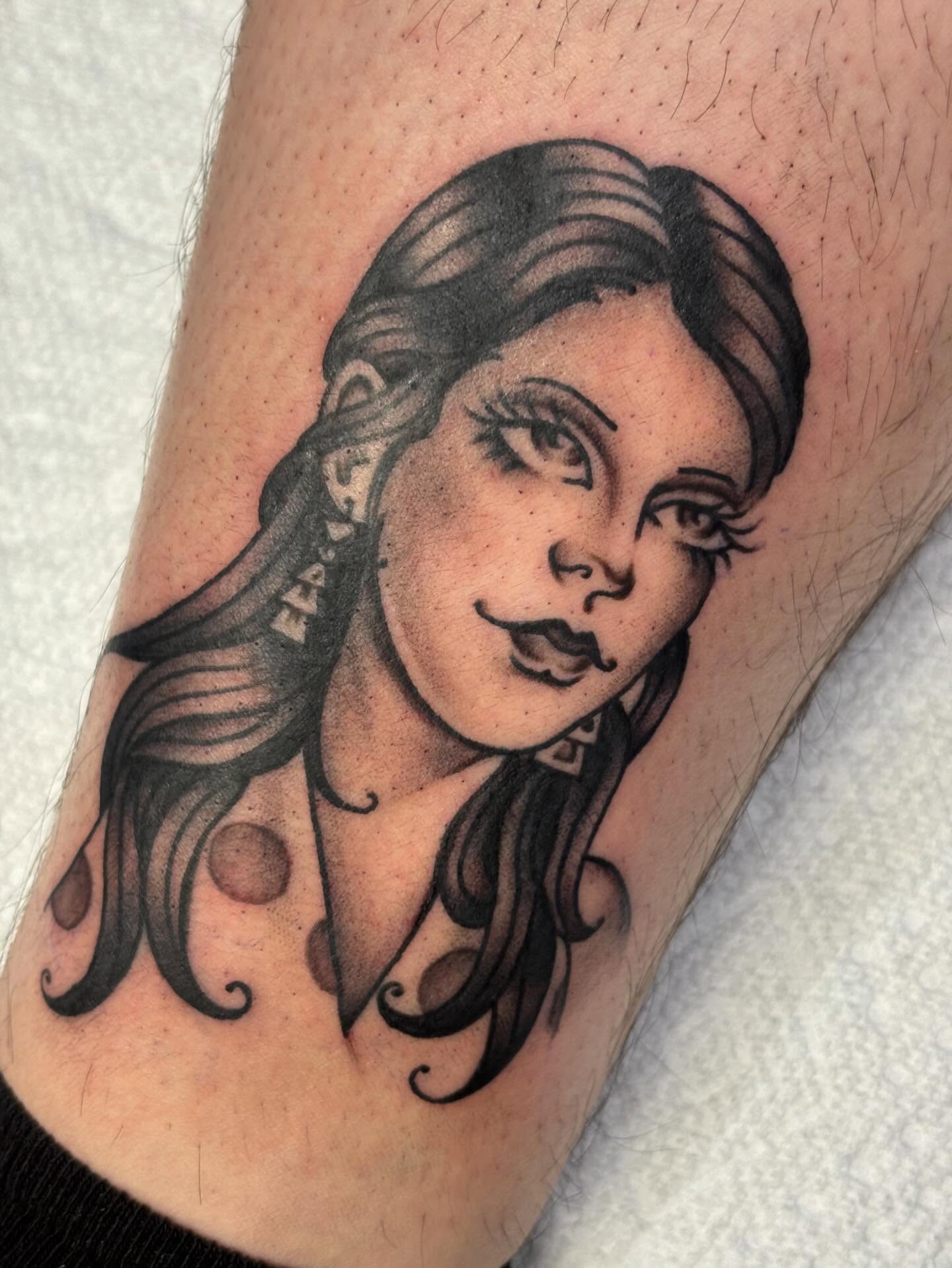 Woman's portrait black and grey tattoo on the forearm by Storm