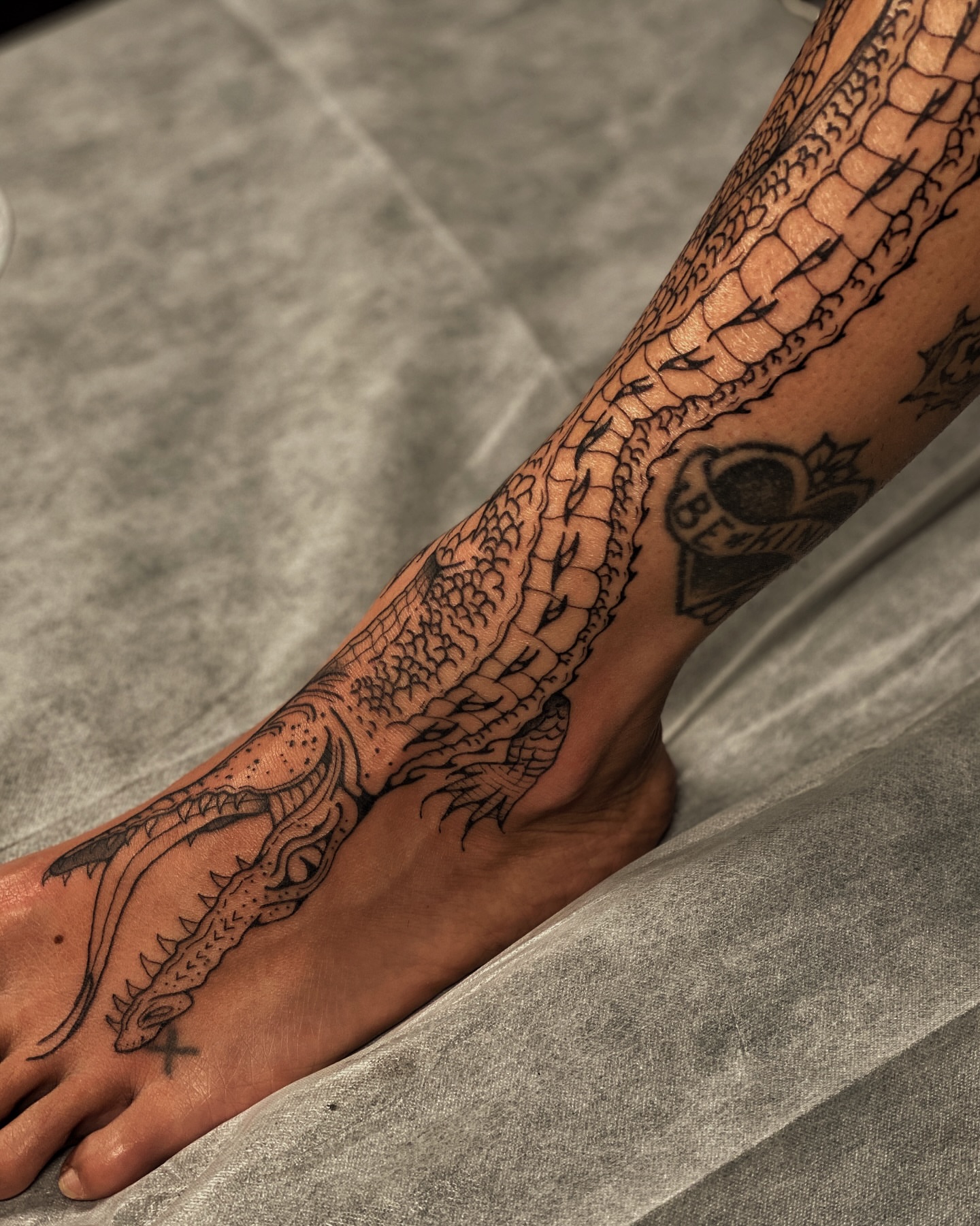 Dragon black and grey tattoo on the foot by Pandora ✨ Floral, Los Angeles, California