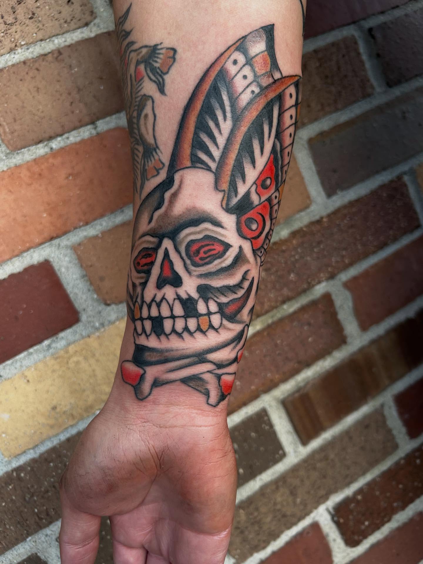 Skull with horns American traditional tattoo on the forearm by Donny