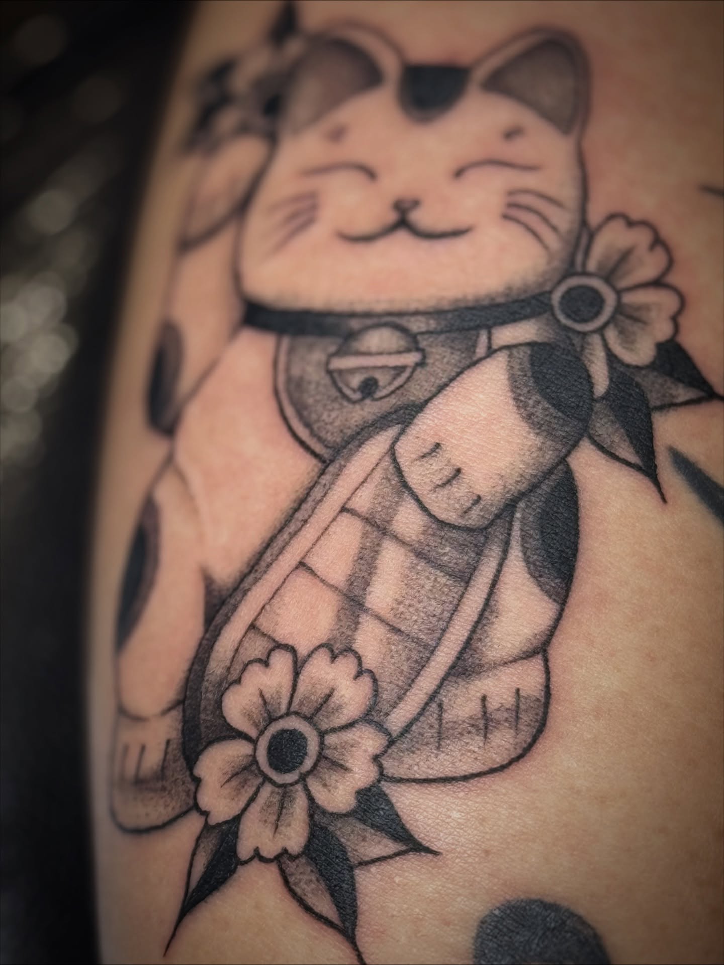 Cat with grenade black and grey tattoo on the forearm by Gianna G