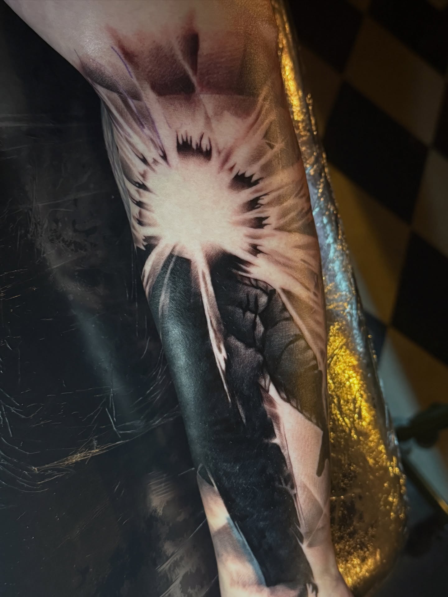 Feather realism tattoo on the forearm by Geoff “Split” DiVittorio