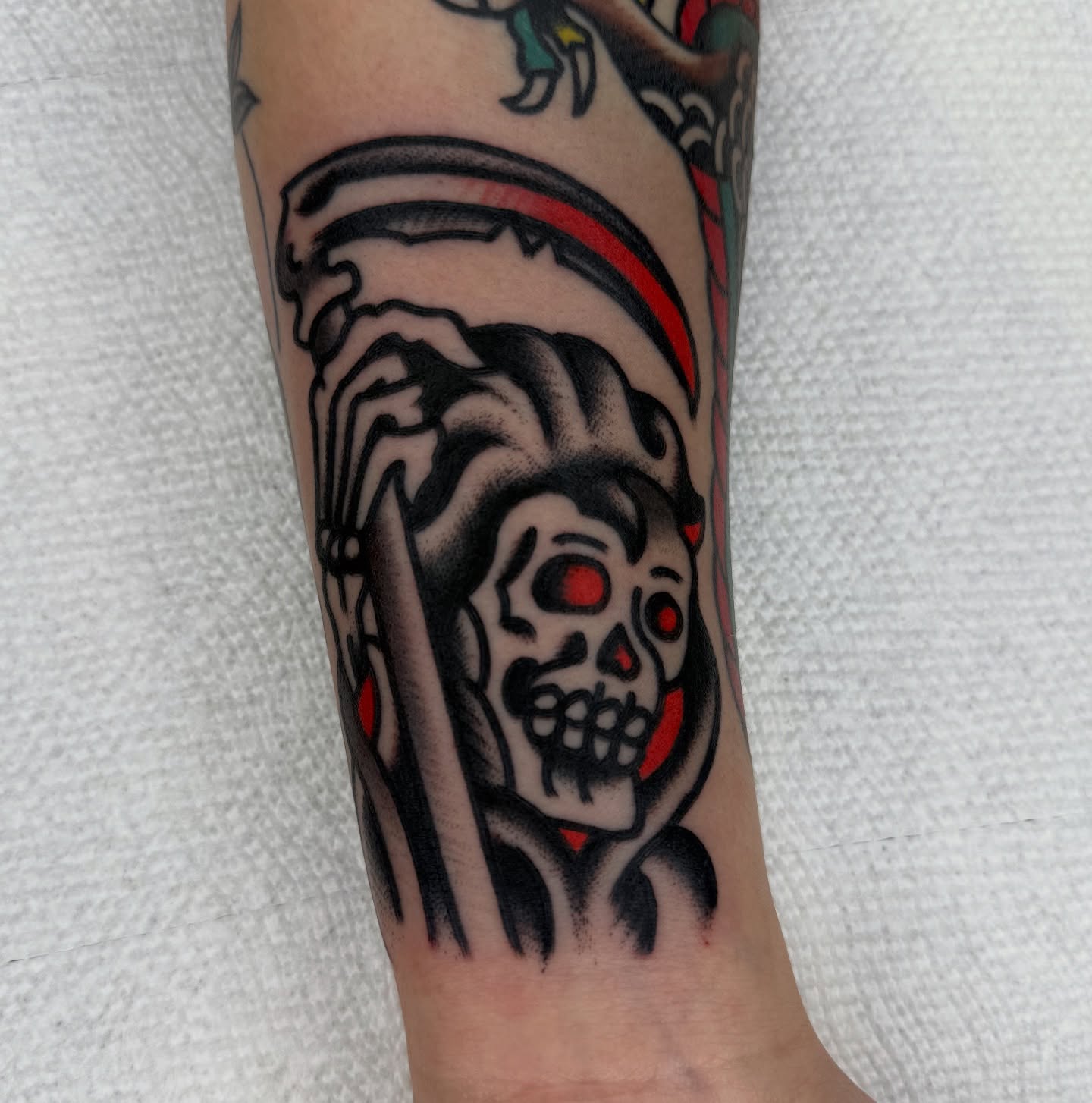 Grim reaper American traditional tattoo on the forearm by لا Kenny McCabe لا
