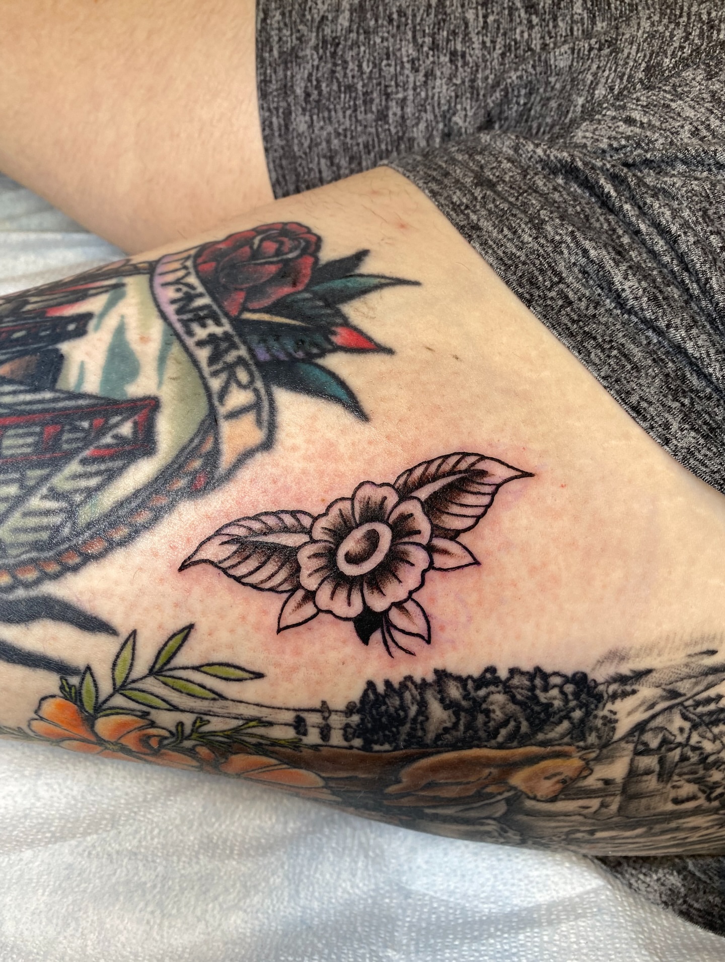 Flower American traditional tattoo on the forearm by Karl Hegwein, Portland, Oregon
