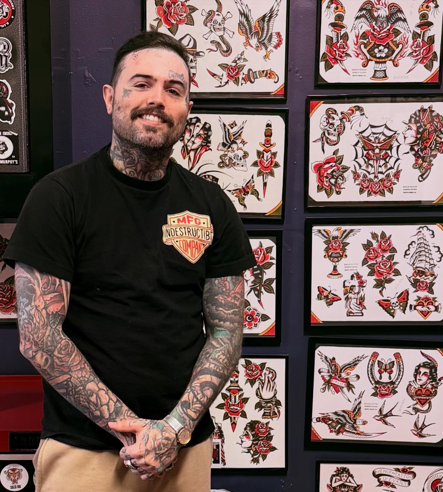 Tattooed man American traditional tattoo on the torso by David Evans