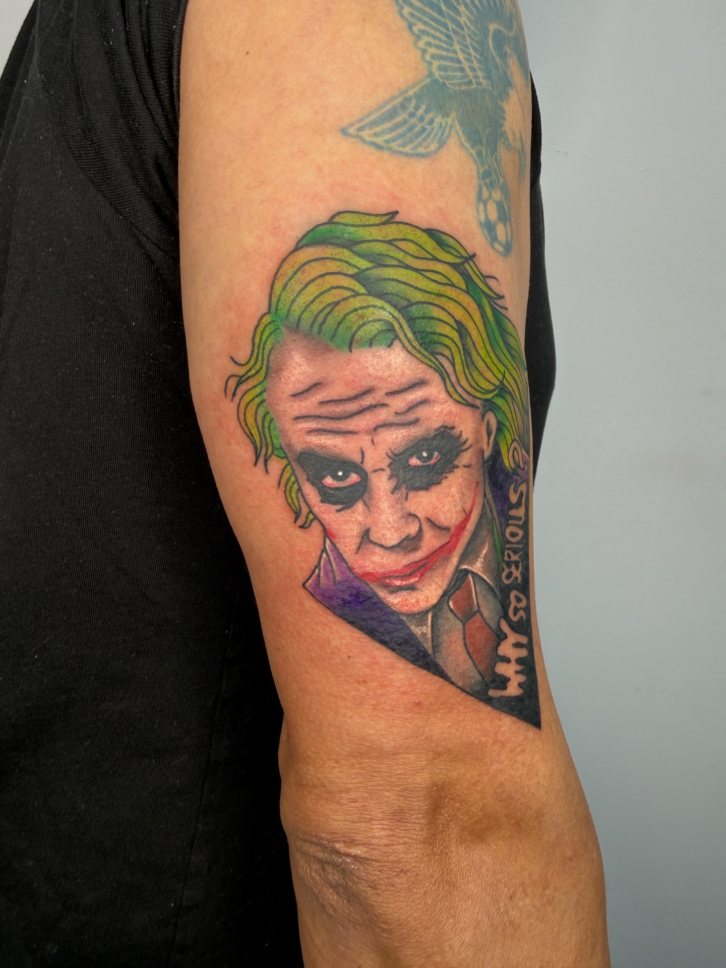 Joker realism tattoo on the forearm by Joshua Carter