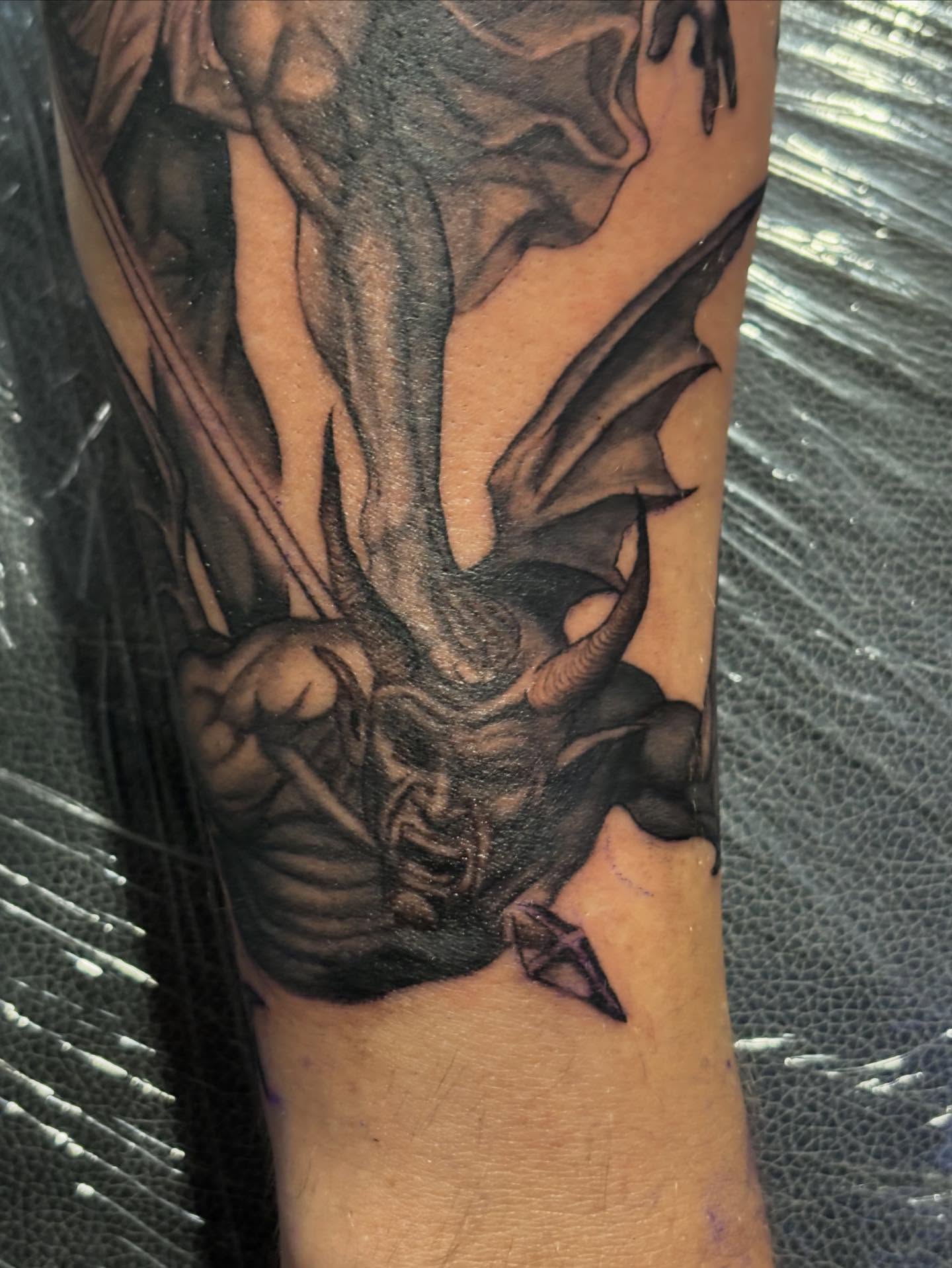 Demon realism tattoo on the forearm by Slade Nowicki