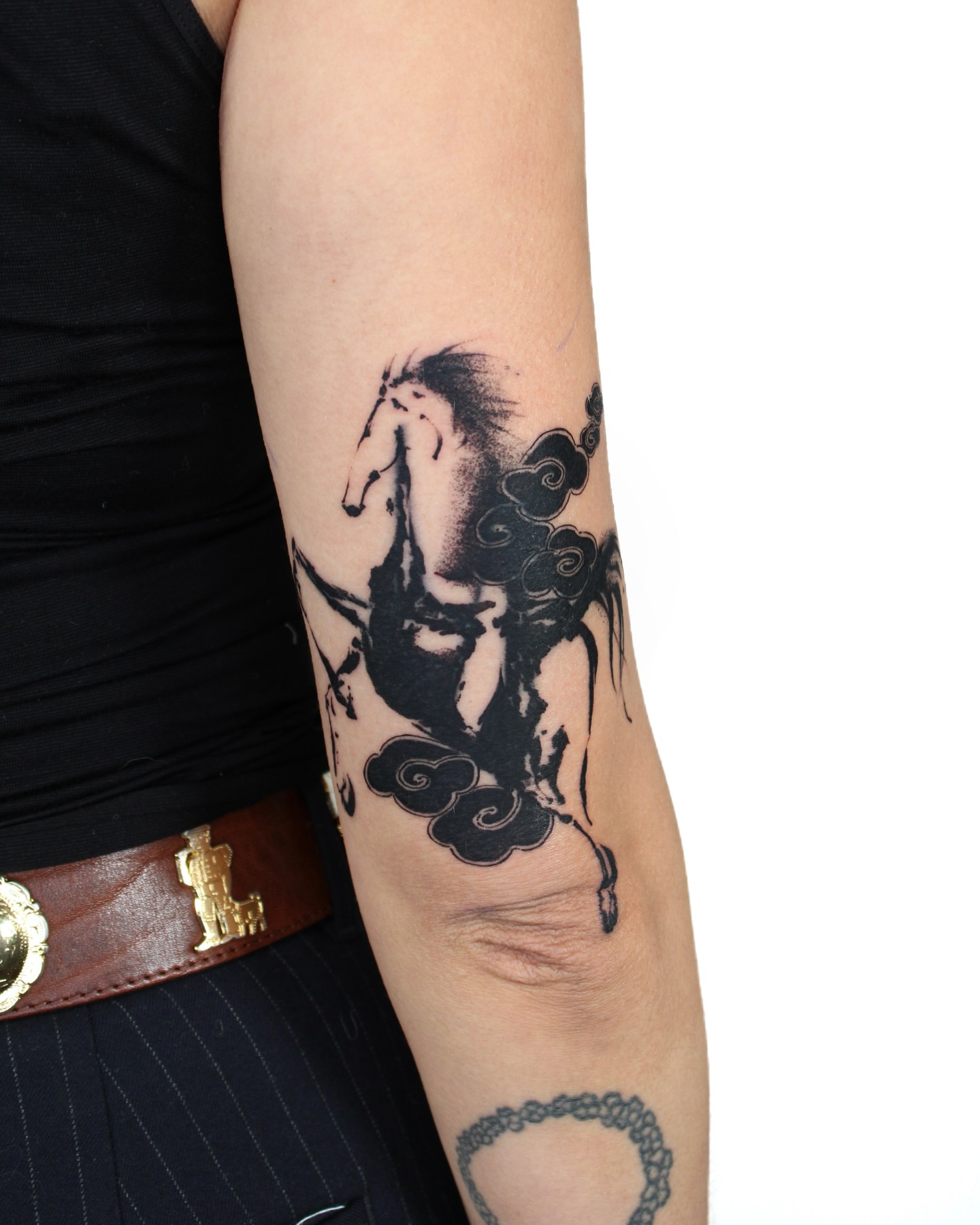 Horse and clouds black and grey tattoo on the forearm by Piao