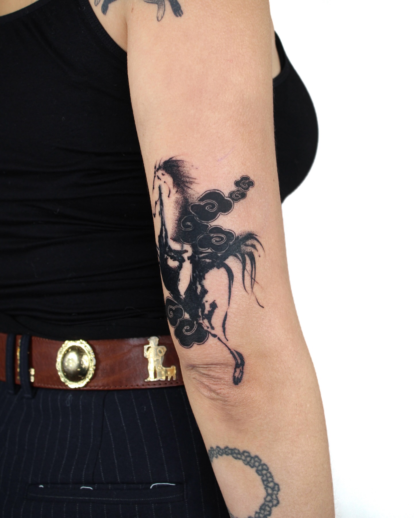 Horse and clouds black and grey tattoo on the forearm by Piao