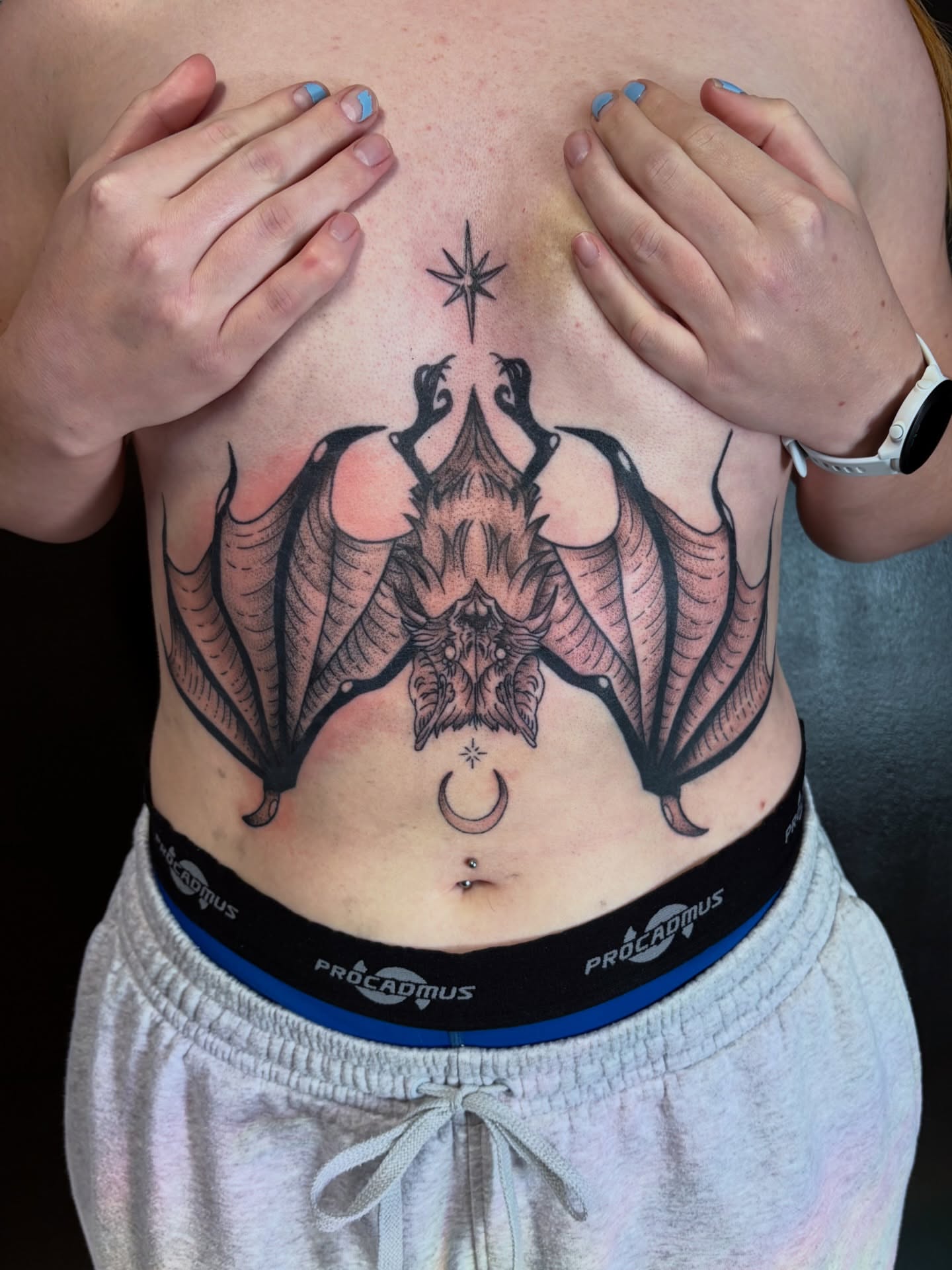 Bat black and grey tattoo on the chest by Rose DeLisse