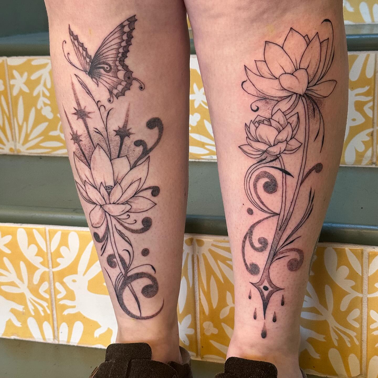 Lotus flowers and butterfly ornamental tattoo on the calf by Jules🕯️
