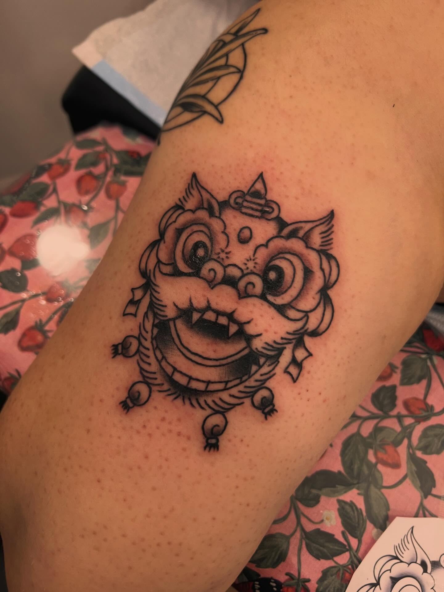Lion head American traditional tattoo on the shoulder by Samantha Citer