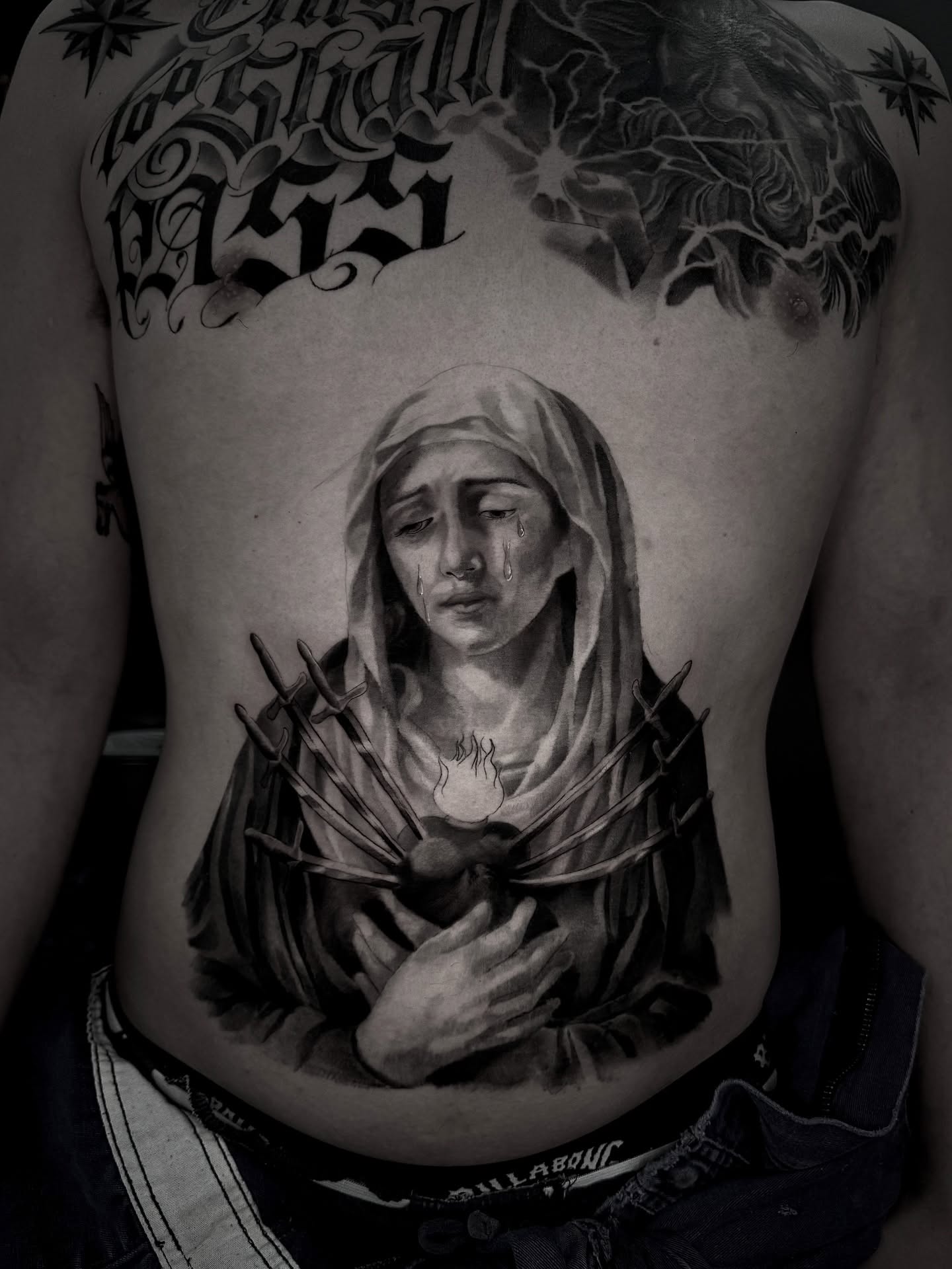 Sorrowful woman realism tattoo on the torso by R O M y R I N C Ó N