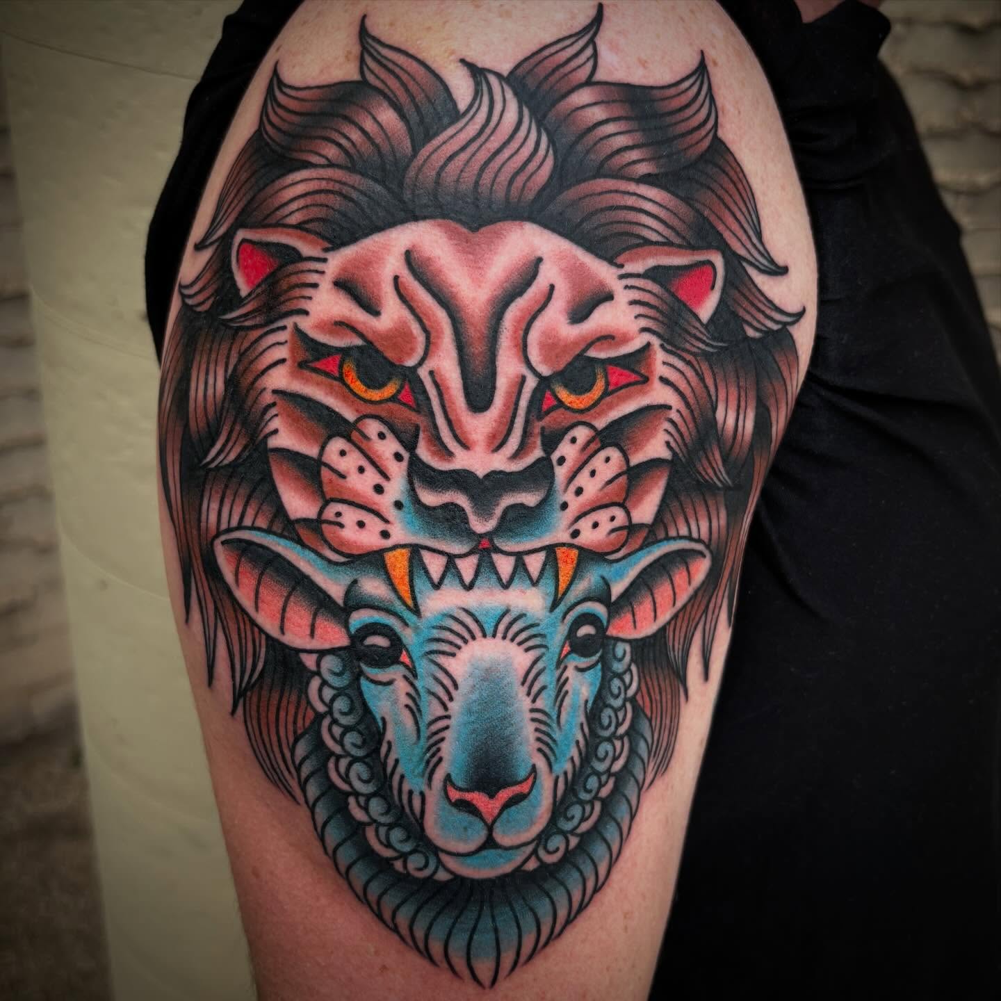 Lion and ram American traditional tattoo on the thigh by Allyson Monique