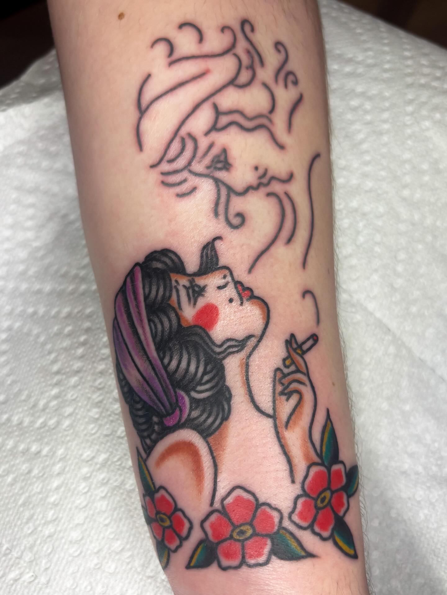 Smoking woman American traditional tattoo on the forearm by Katelyn Spence