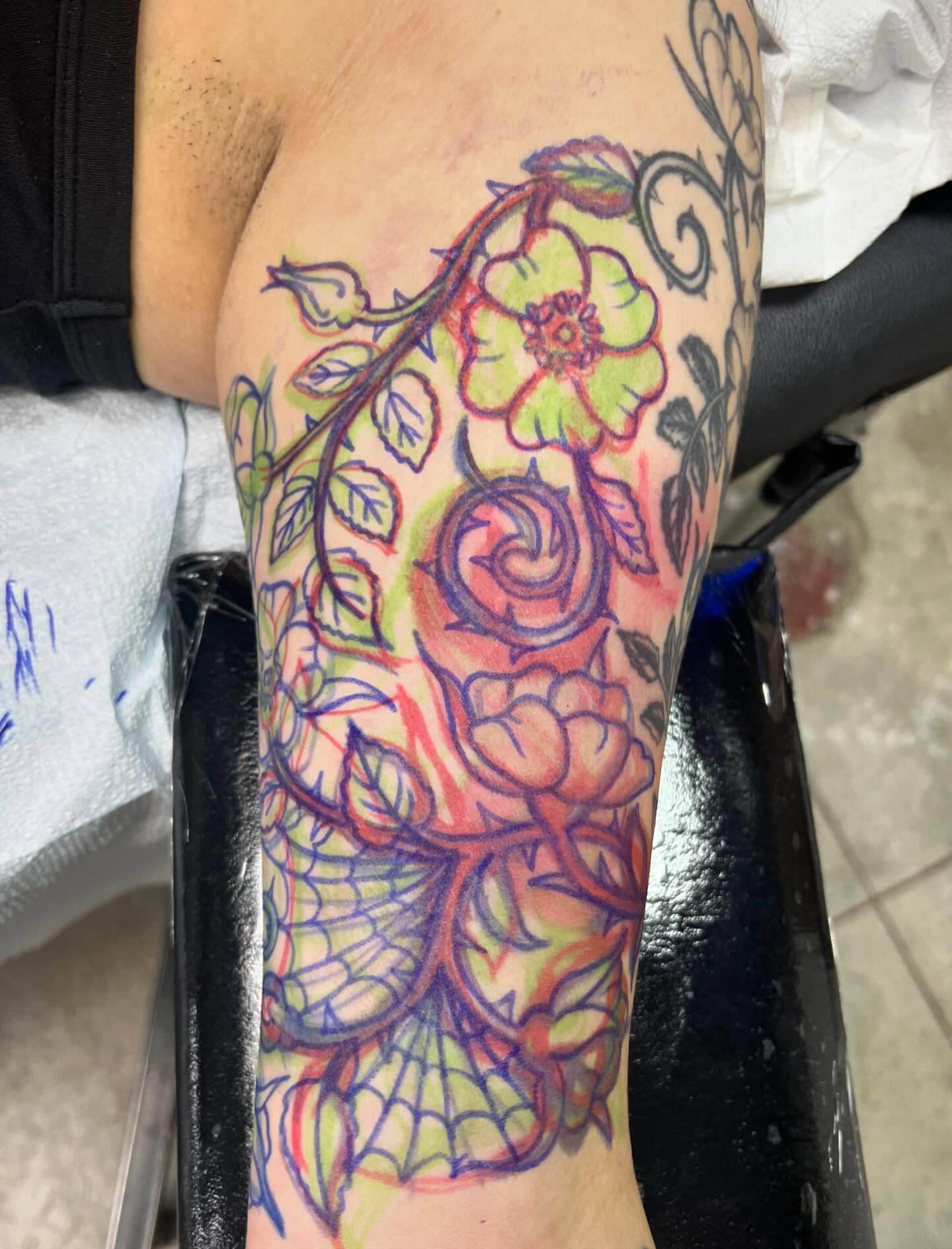 Floral vine watercolor tattoo on the forearm by Natalie Phillips, Oakland, California
