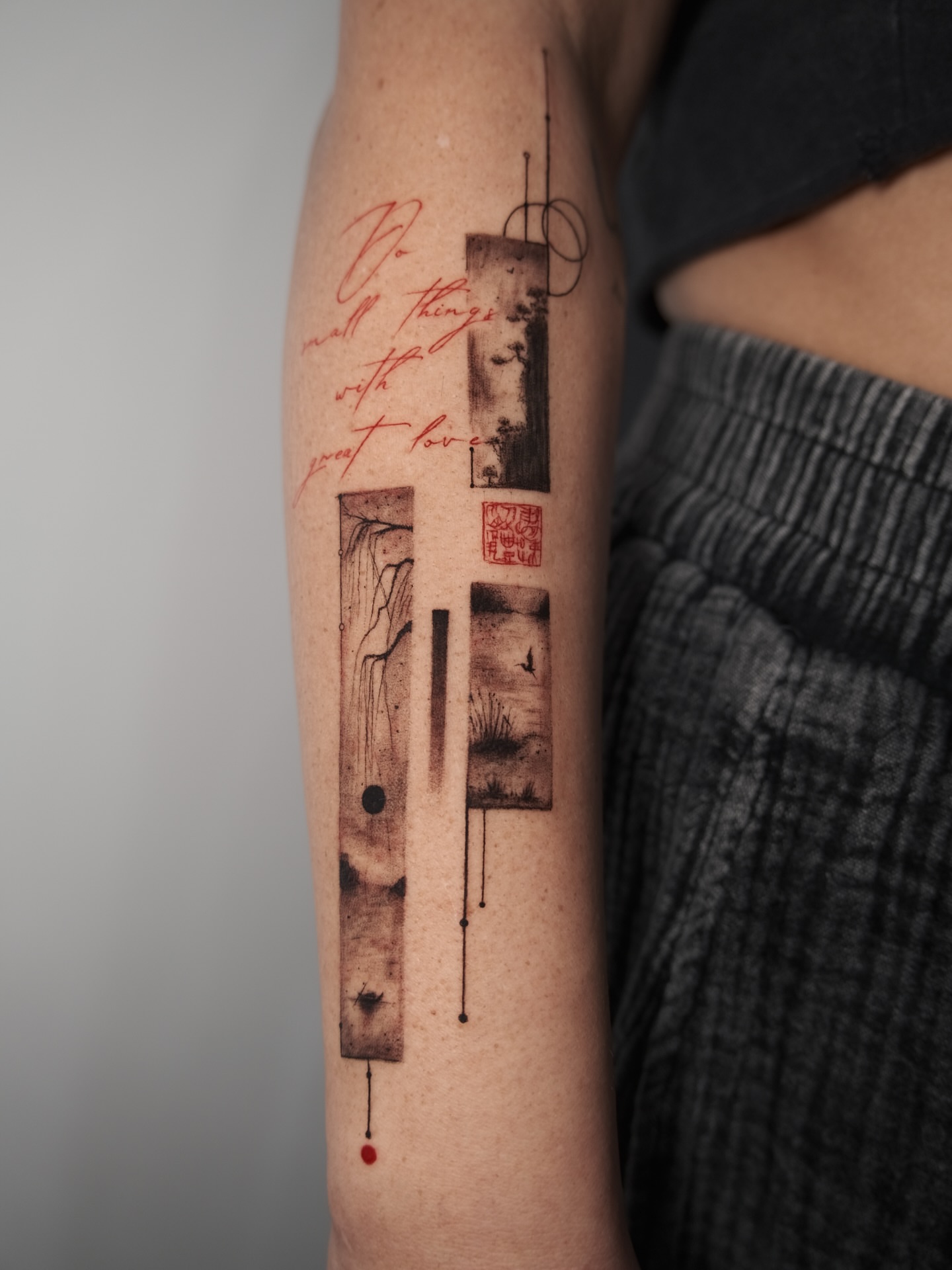 Calligraphy and landscape dotwork tattoo on the forearm by Lily K.