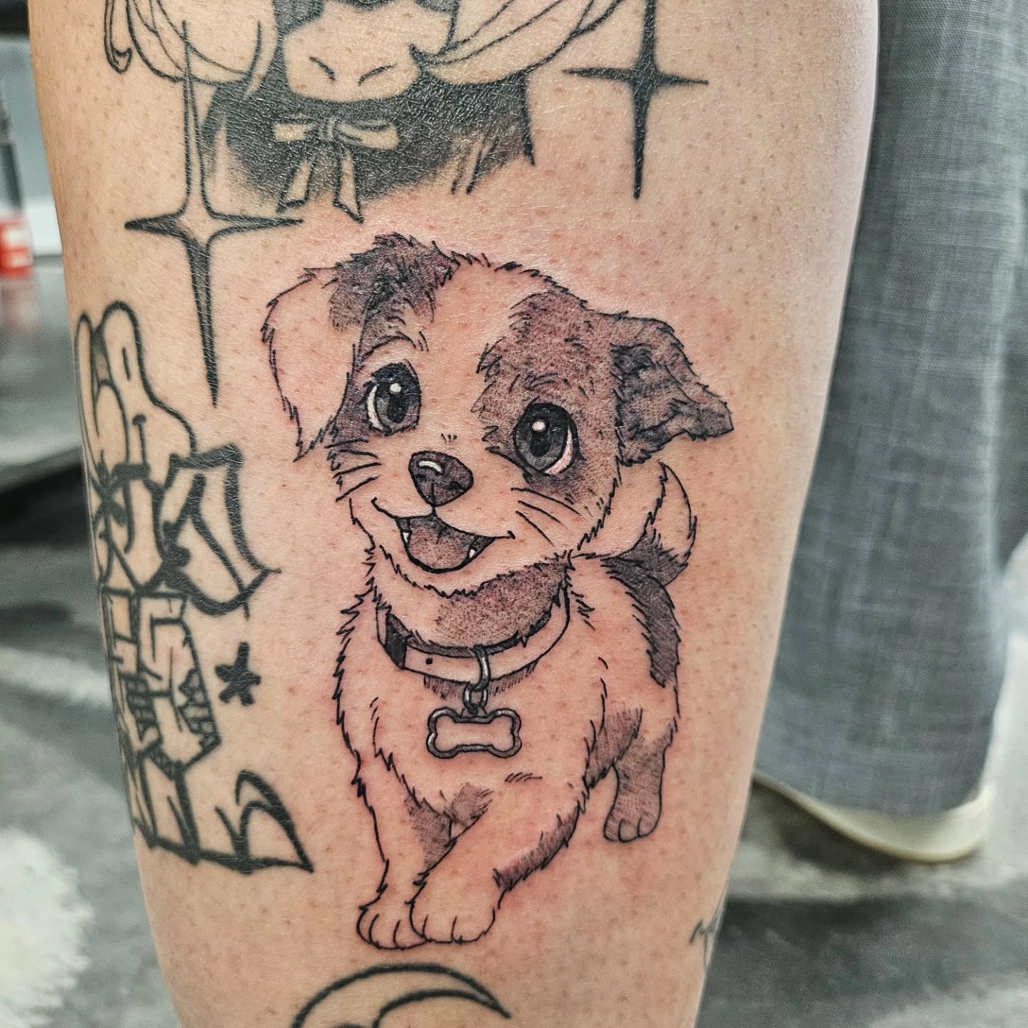Puppy black and grey tattoo on the forearm by 𝕸 𝖆 𝖓 𝖔 𝖑 𝖔