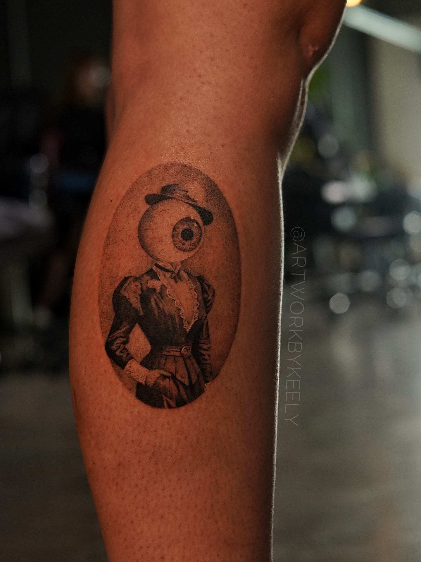 Eye with Victorian attire realism tattoo on the forearm by Keely Thompson