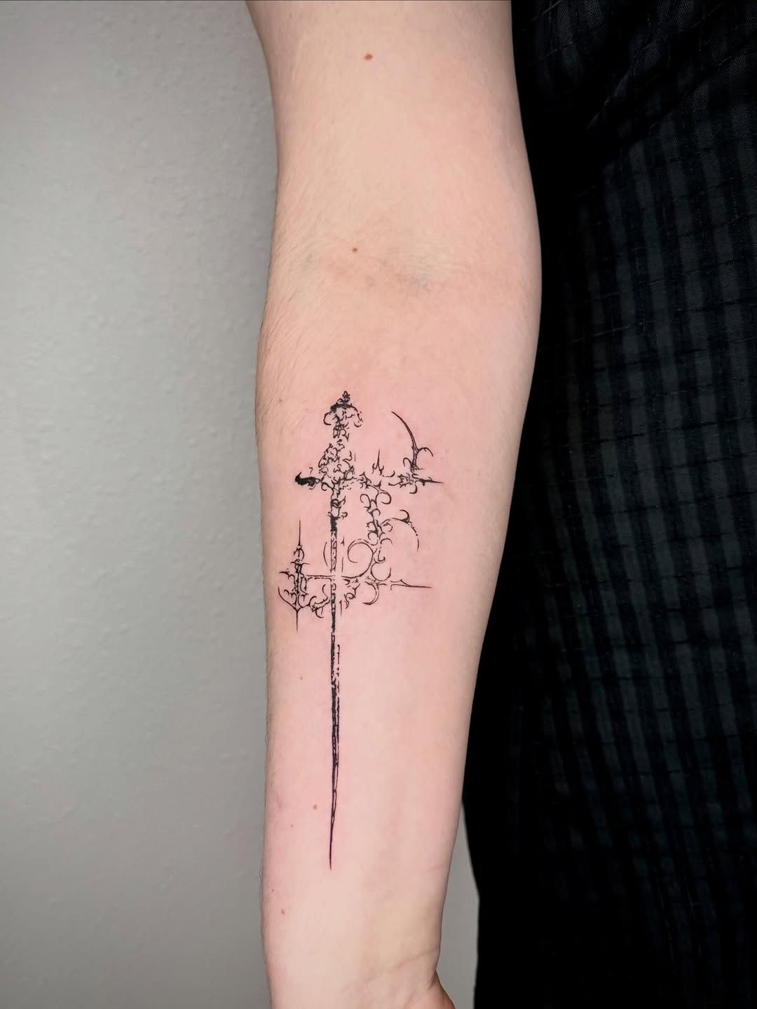 Ornamental sword blackwork tattoo on the forearm by 🤍 Sarah 🖤