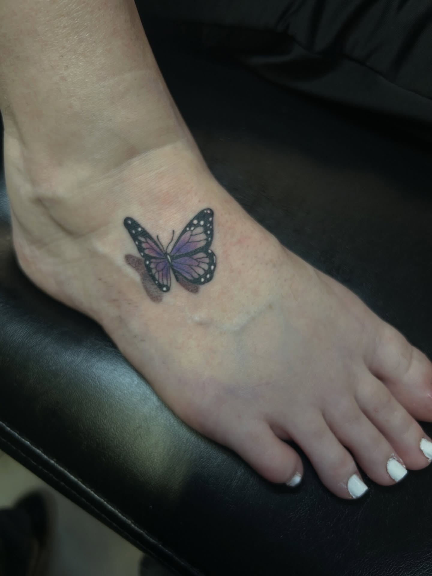 Butterfly dotwork tattoo on the foot by Torrey, Austin, Texas