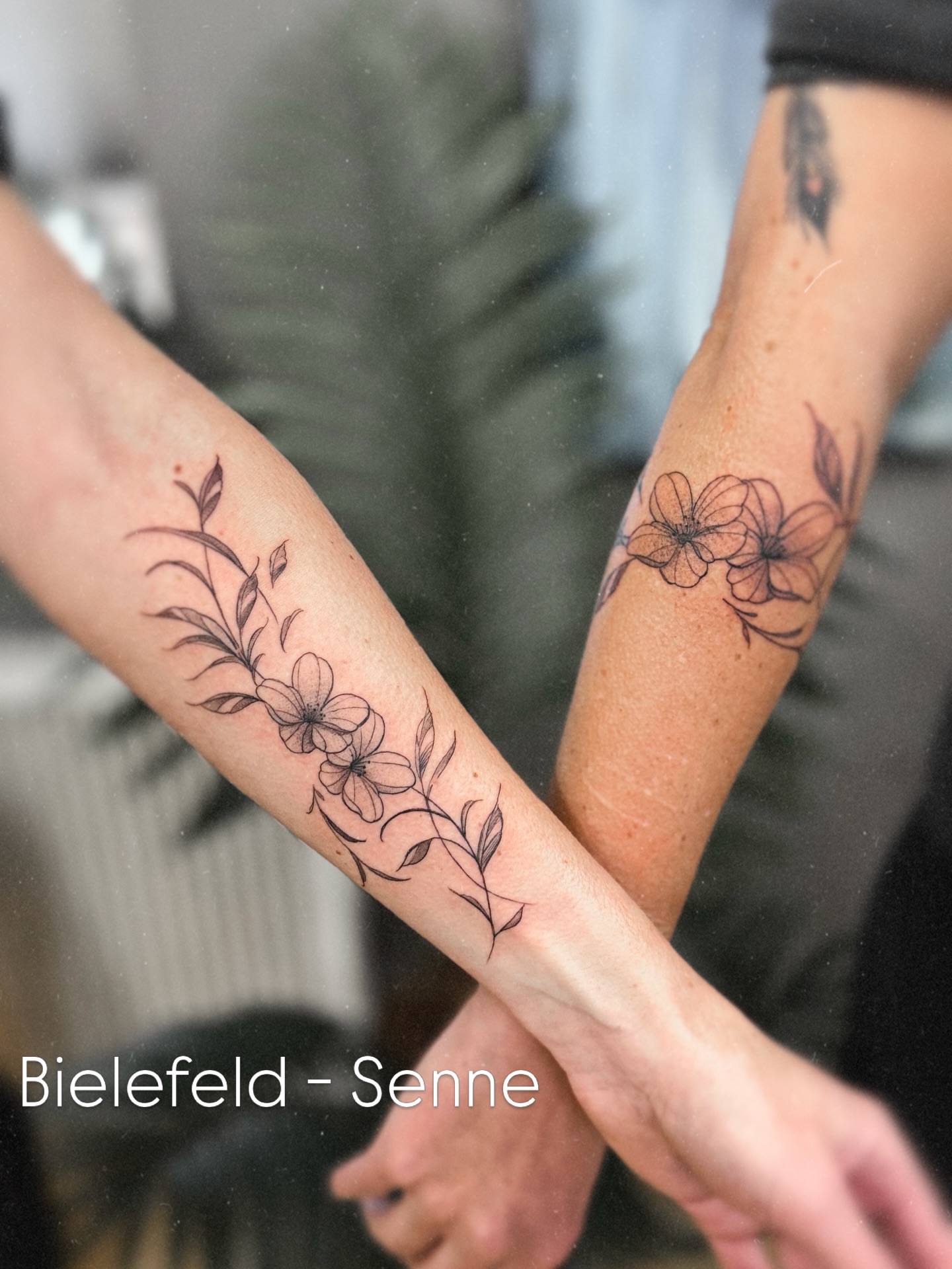 Floral arrangement black and grey tattoo on the forearm by Die Ivo, Bielefeld, Germany