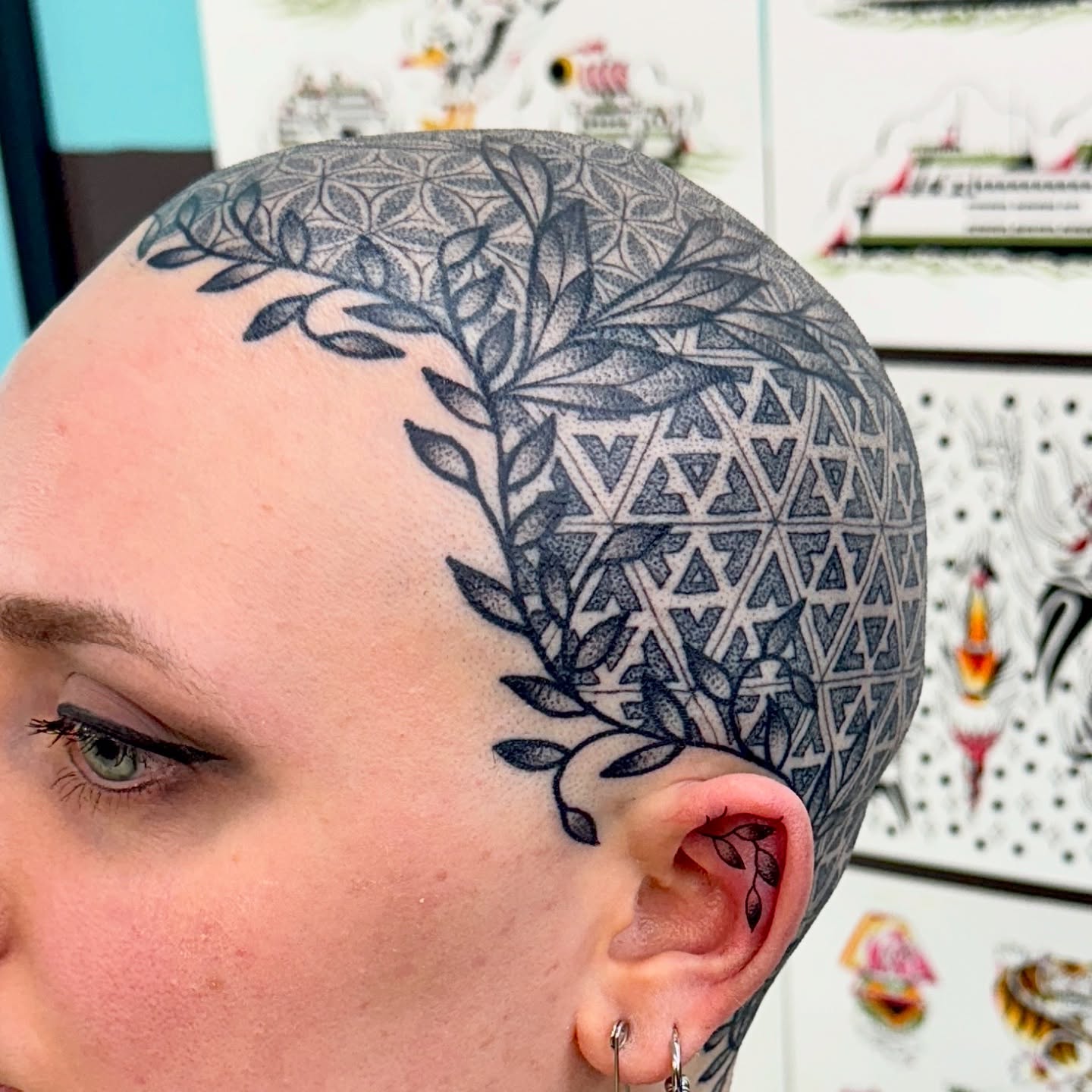 Geometric pattern dotwork tattoo on the head by Sam