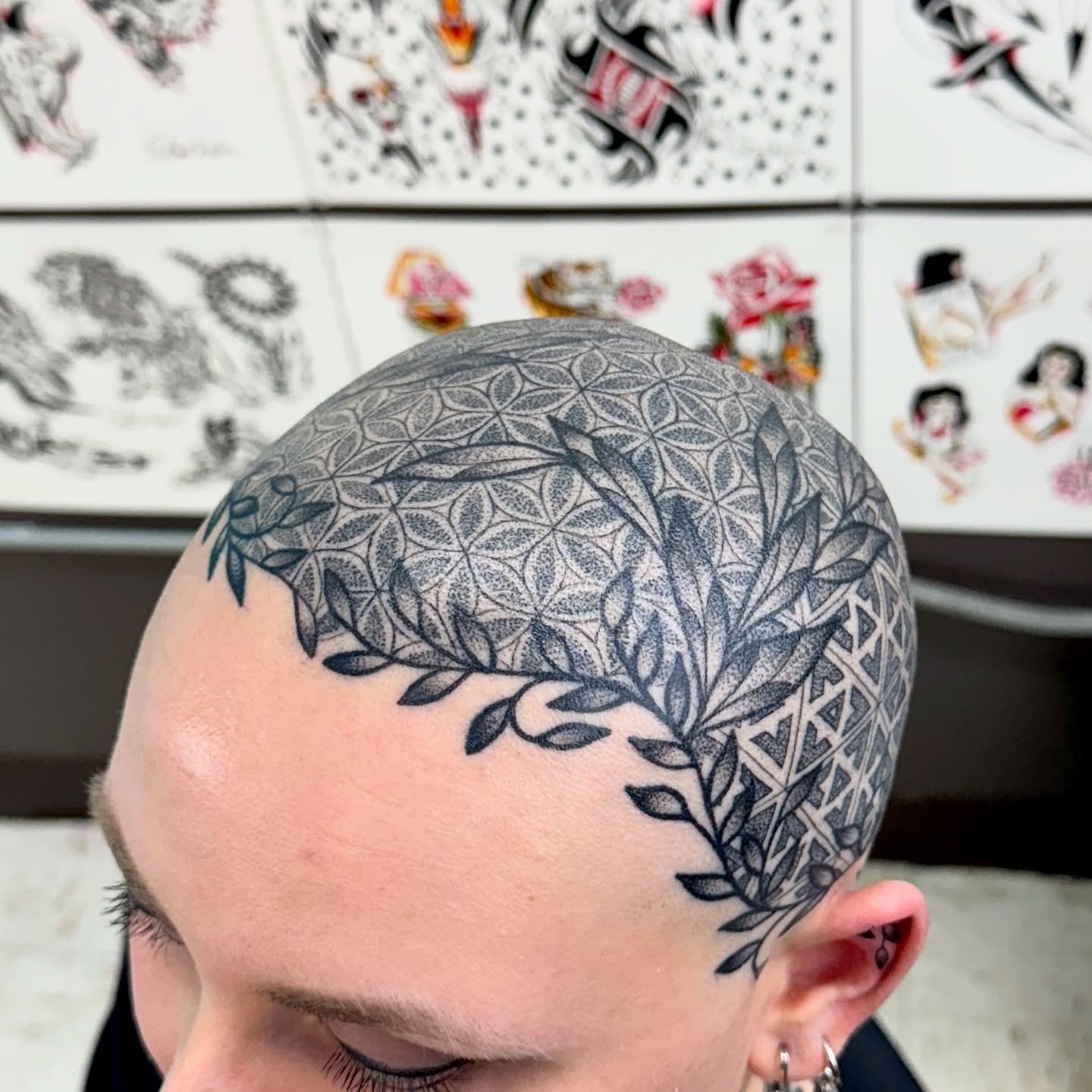 Geometric pattern dotwork tattoo on the head by Sam