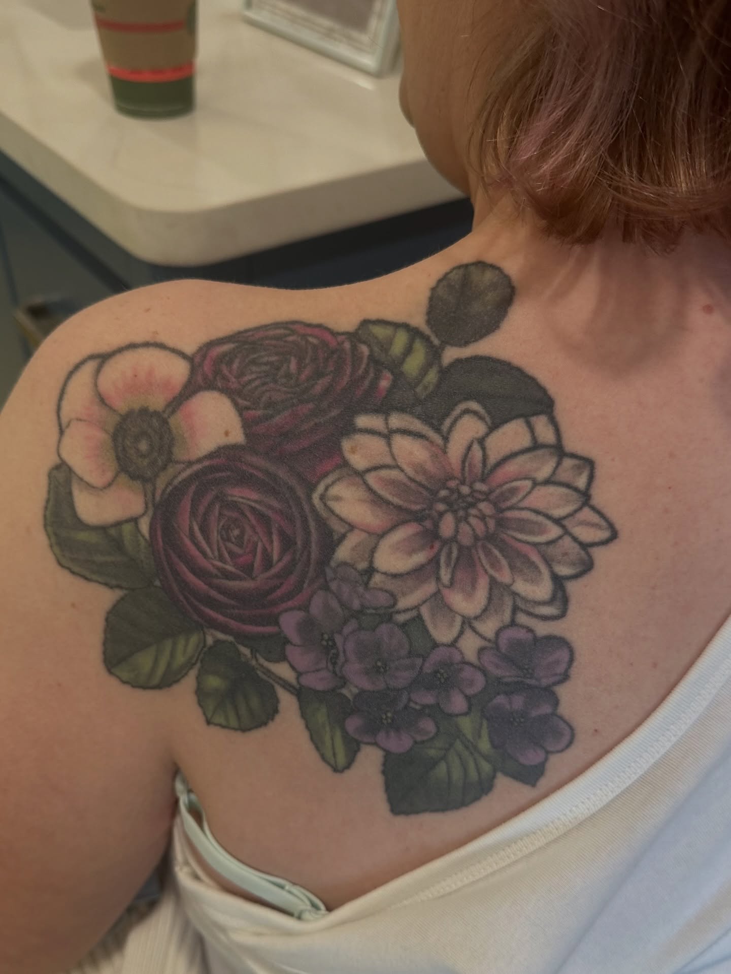 Flower bouquet realism tattoo on the shoulder by Katie Hutchins, Dayton, Ohio