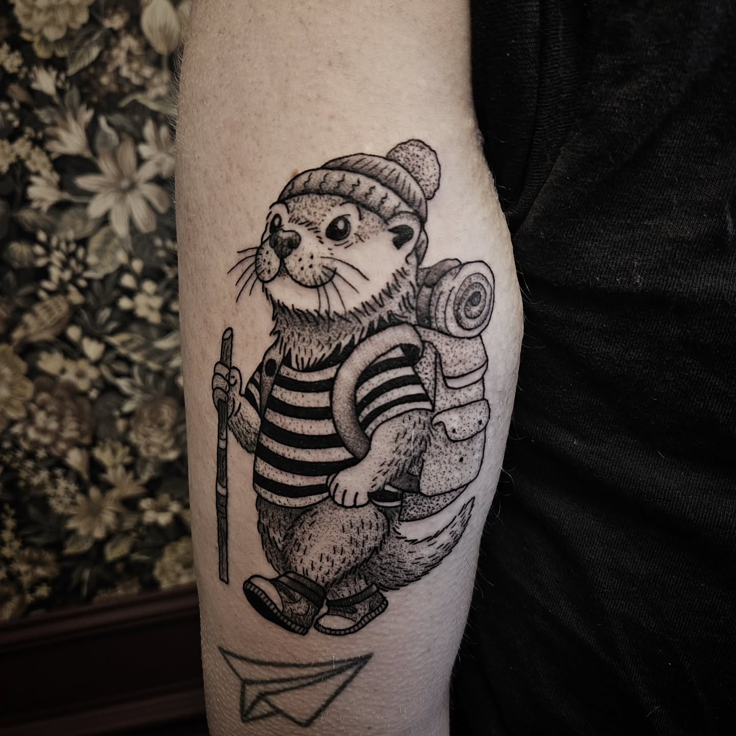 Otter black and grey tattoo on the forearm by Kirk George