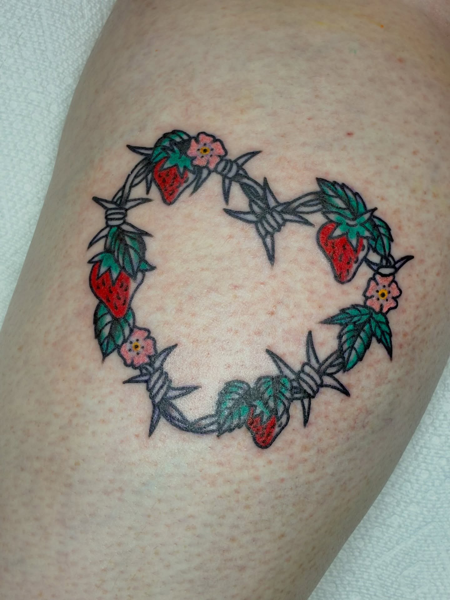 Barbed wire wreath American traditional tattoo on the thigh by Sav Robinson