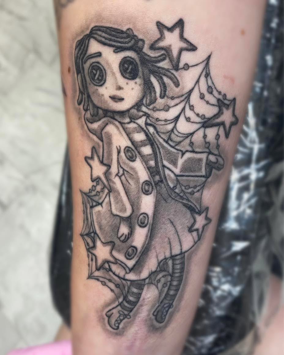 Coraline character with stars realism tattoo on the forearm by Louisiana Tattoo Apprentice