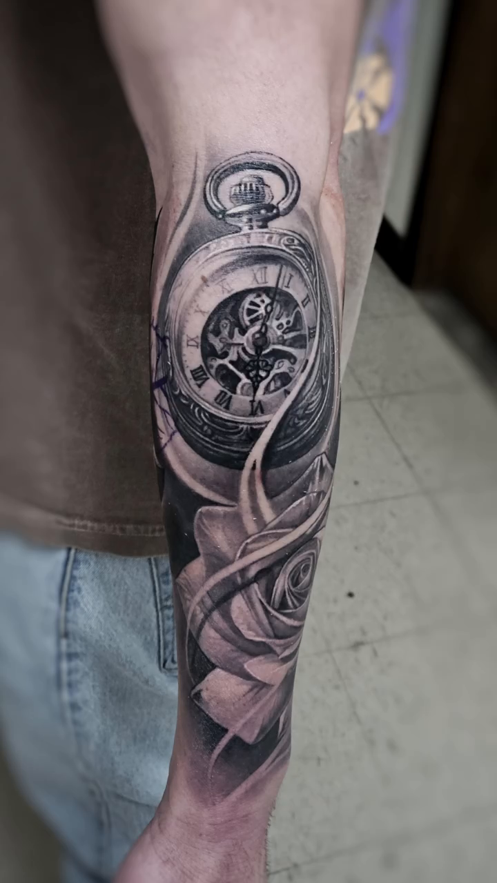 Rose and pocket watch realism tattoo by Tyler Malek