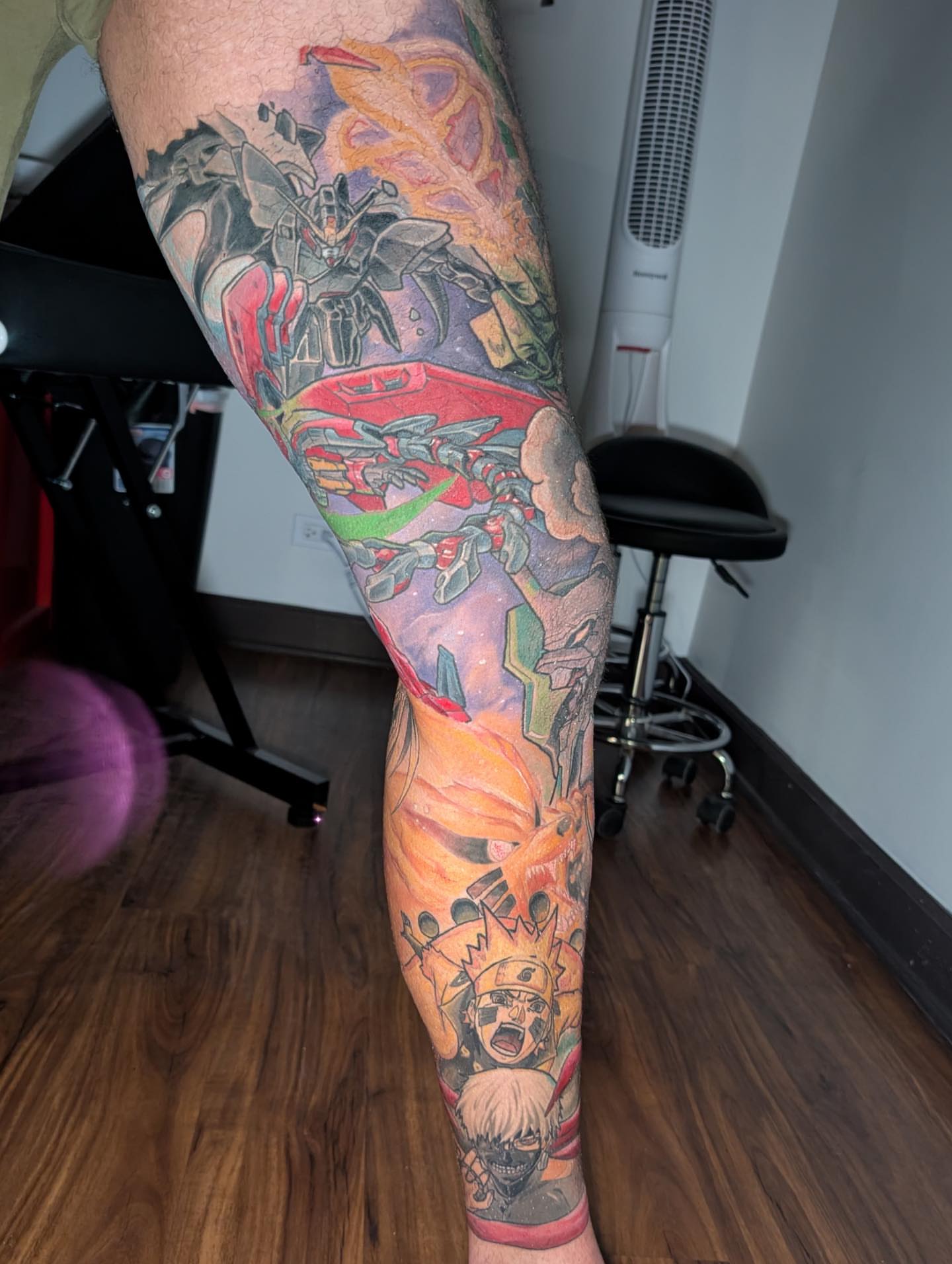 Anime characters and mecha anime tattoo on the forearm by Will Alexander, Lombard, Illinois