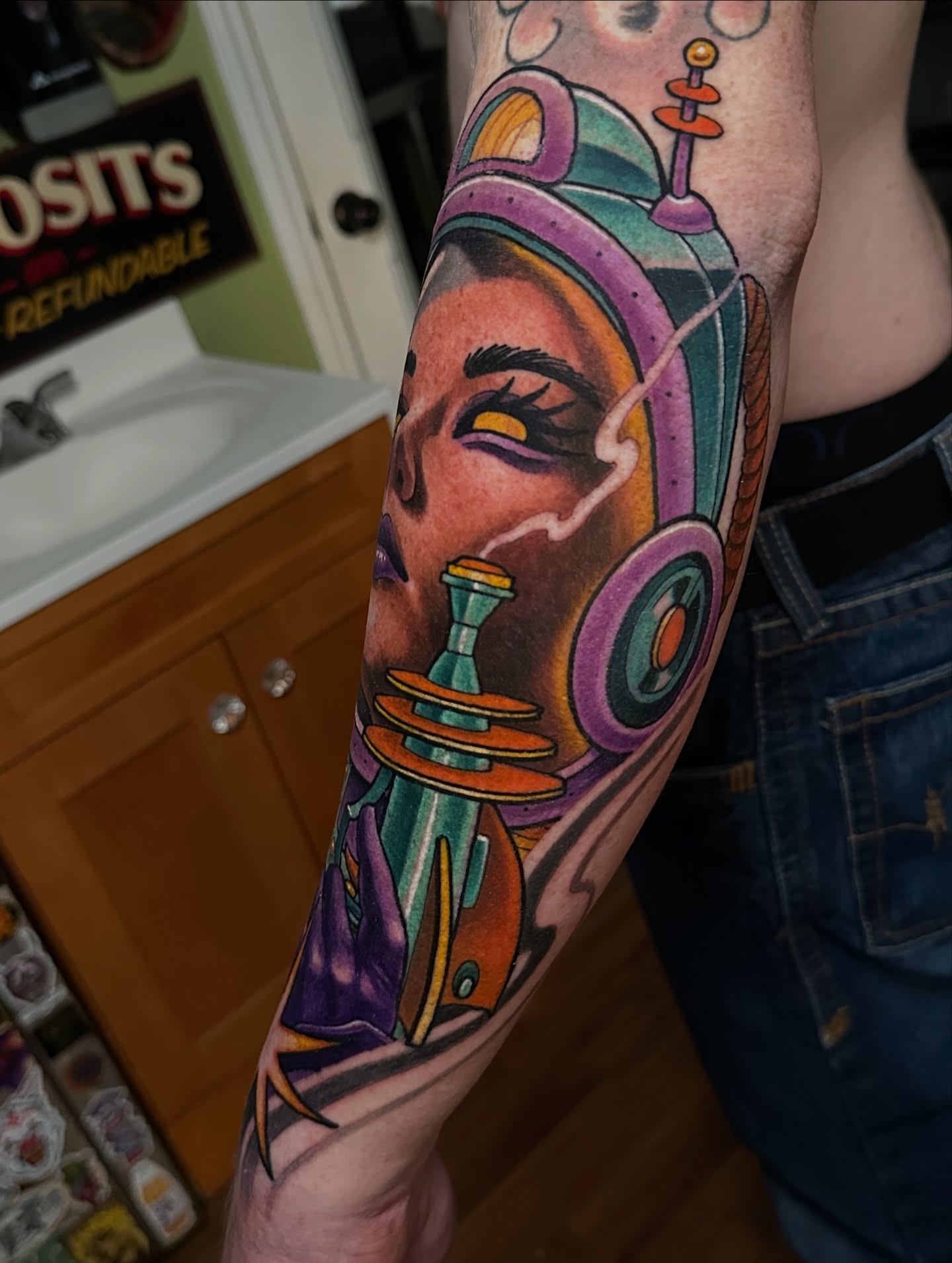 Space helmet new school tattoo on the forearm by Trevor Burtz