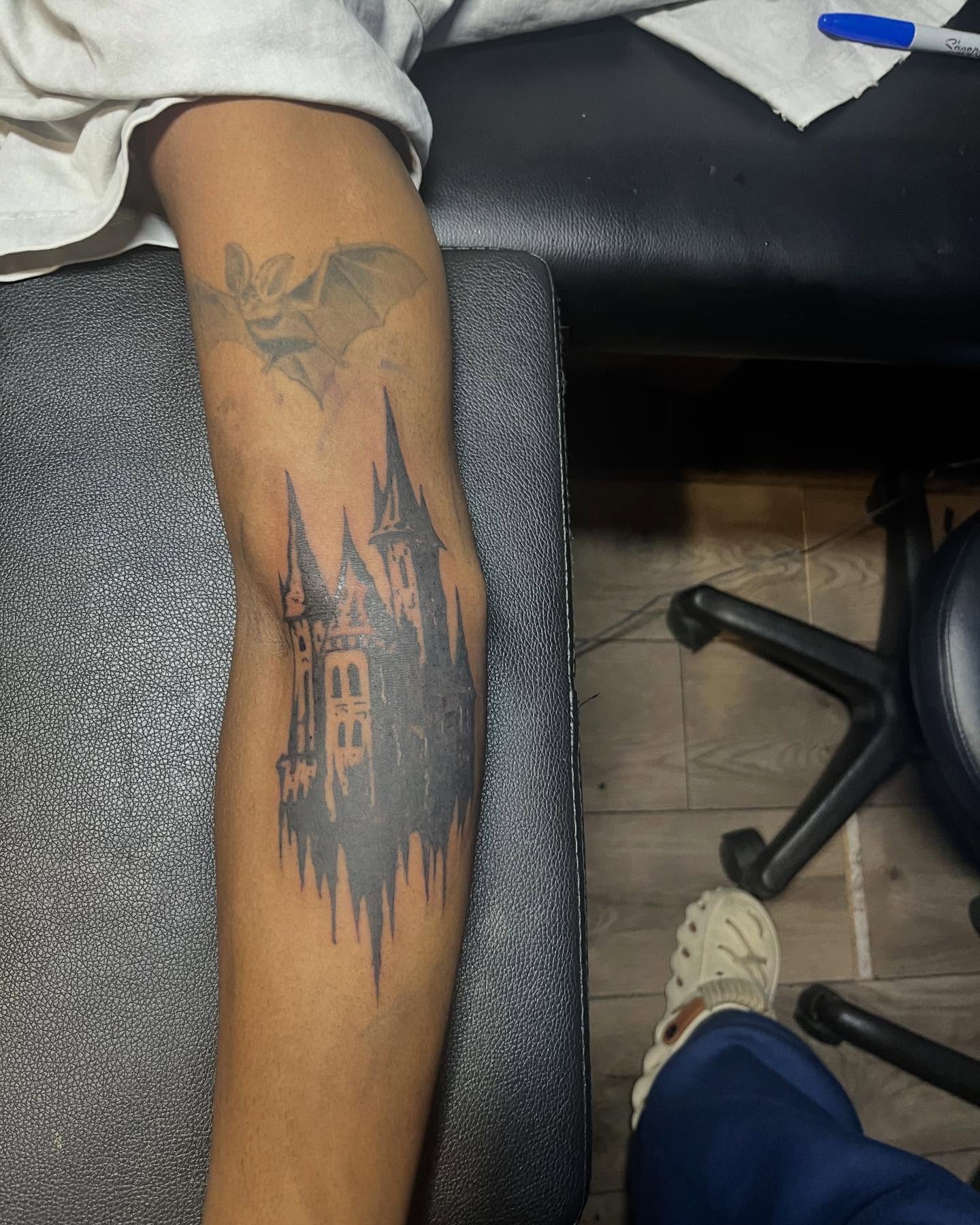 Castle black and grey tattoo on the forearm by SpicyMvstardInkk