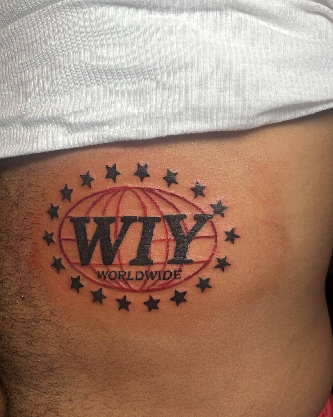 WIY Worldwide American traditional tattoo on the ribs by SpicyMvstardInkk