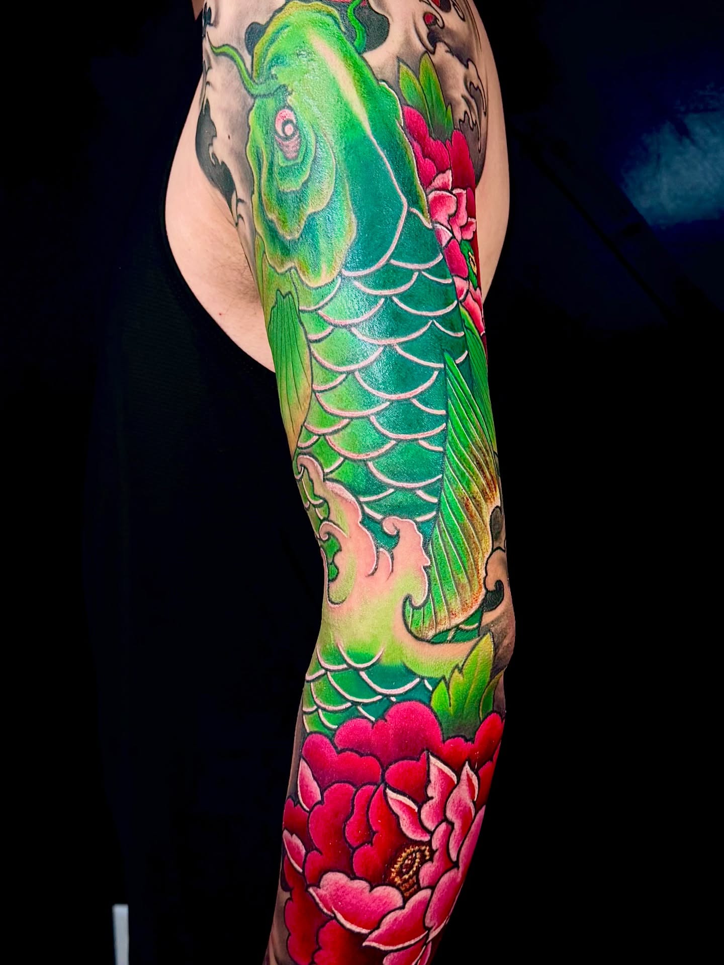 Koi fish and peonies japanese irezumi tattoo on the forearm by John Ayson, Murrieta, California