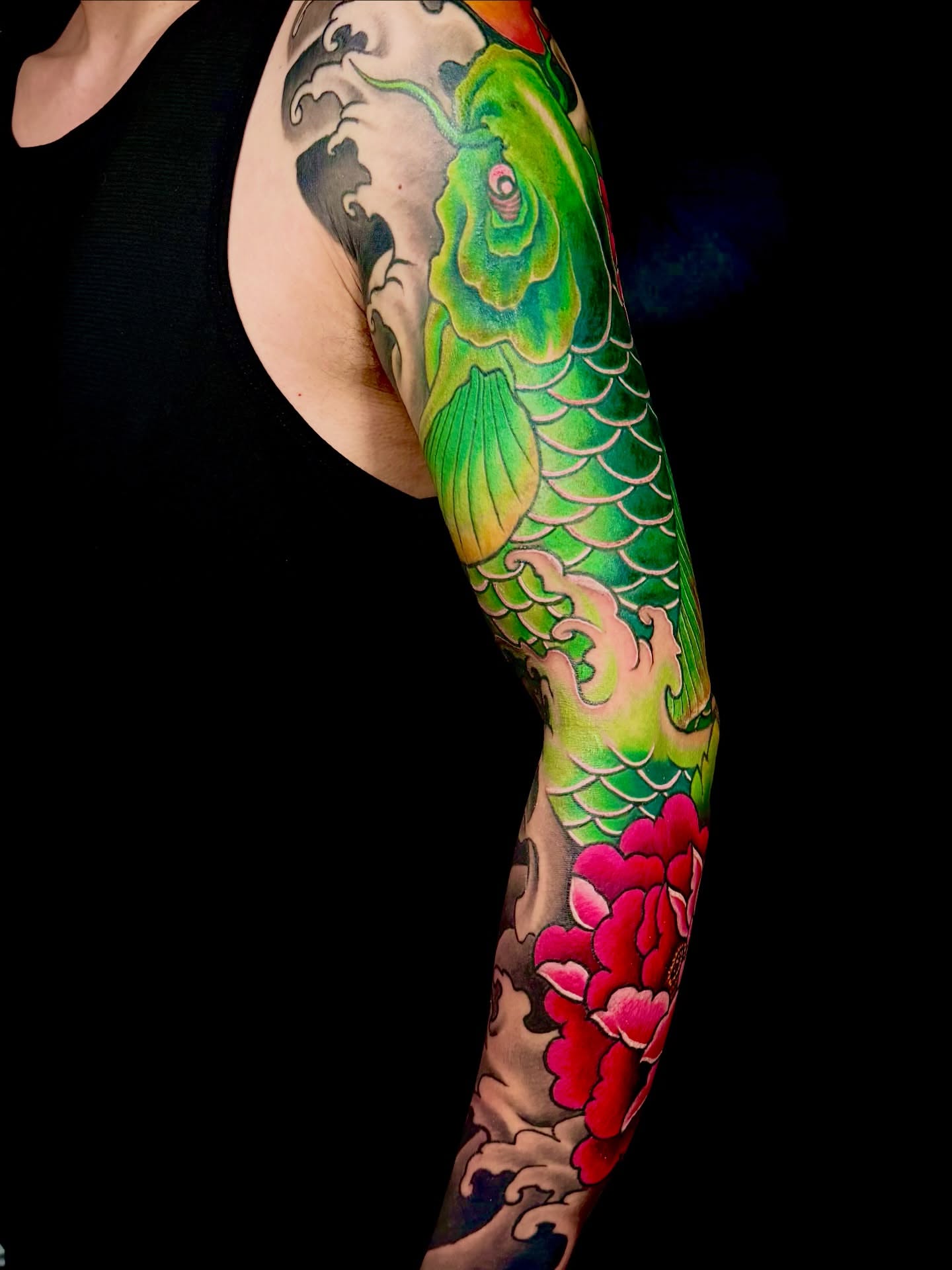 Koi fish and peony japanese irezumi tattoo on the forearm by John Ayson, Murrieta, California