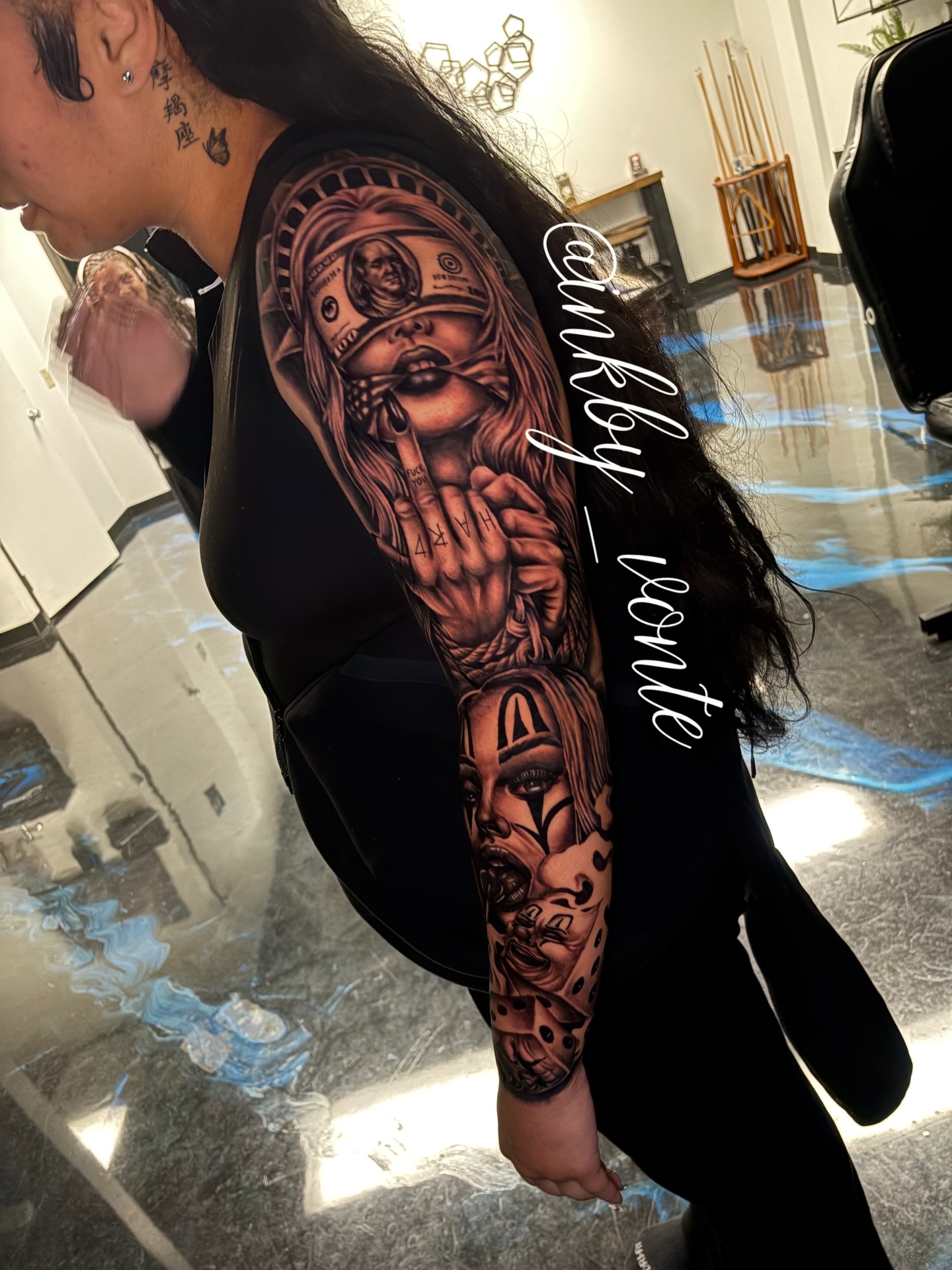 Woman with mask American traditional tattoo on the upper arm by Vonte Seay