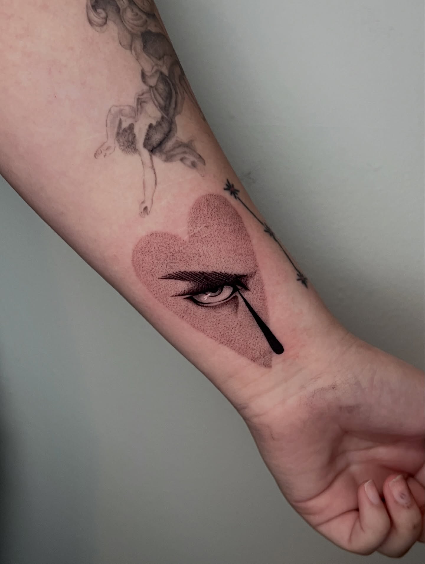 Eye and heart dotwork tattoo on the forearm by AJ π°π· LA tattoo