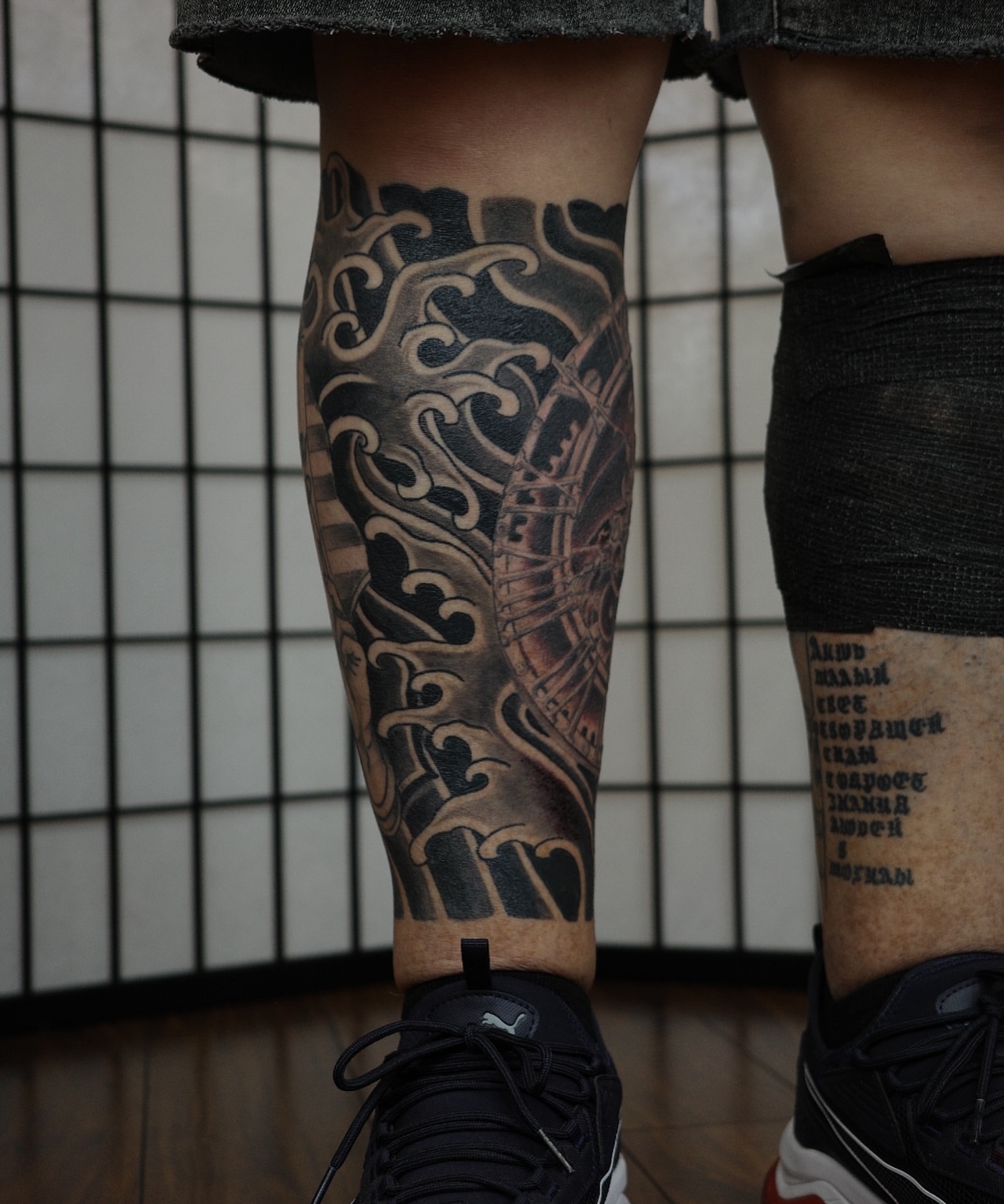 Wave and ship realism tattoo on the calf by Innokenty Meshchakov, Portland, Oregon
