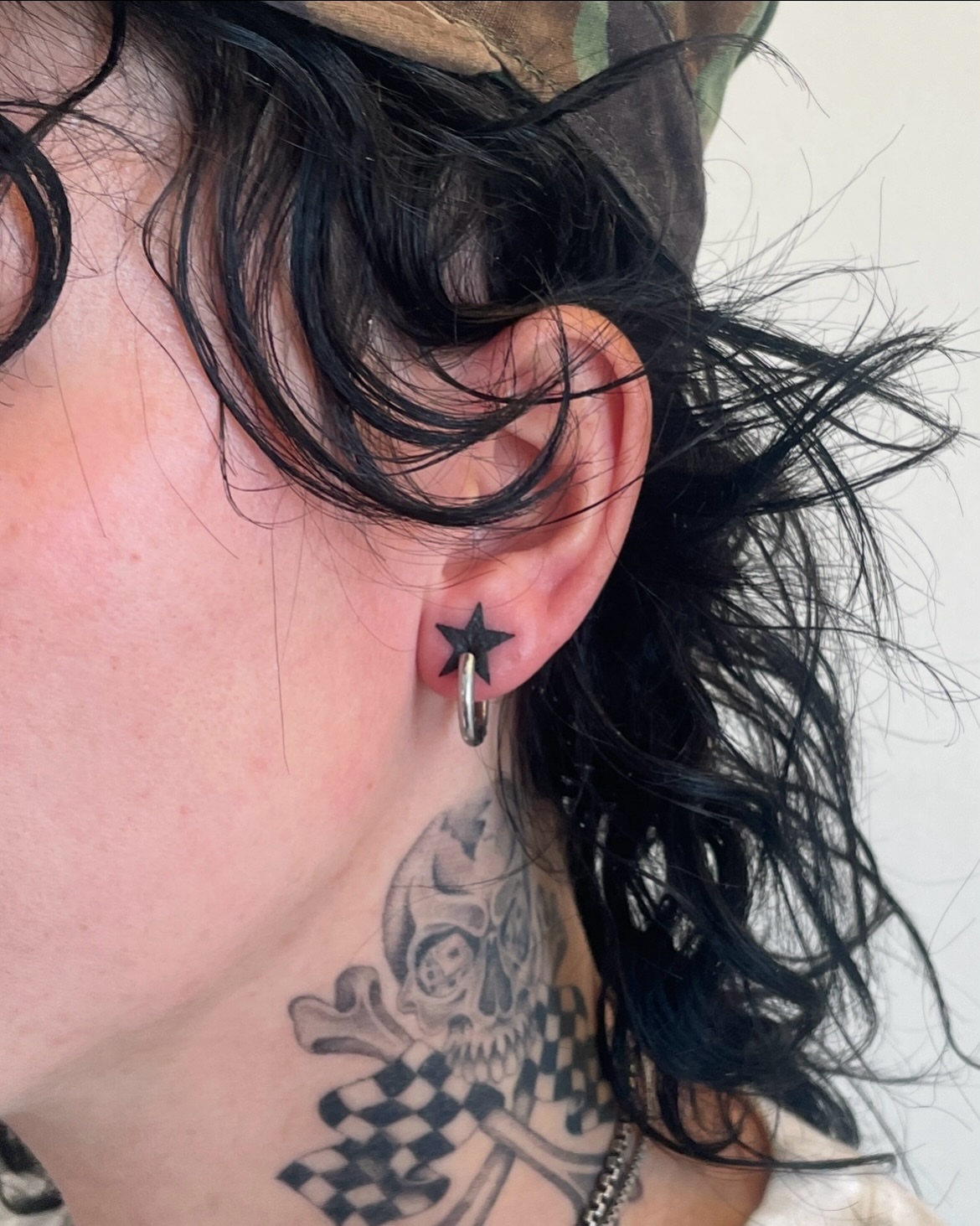 Star black and grey tattoo on the neck by IVY