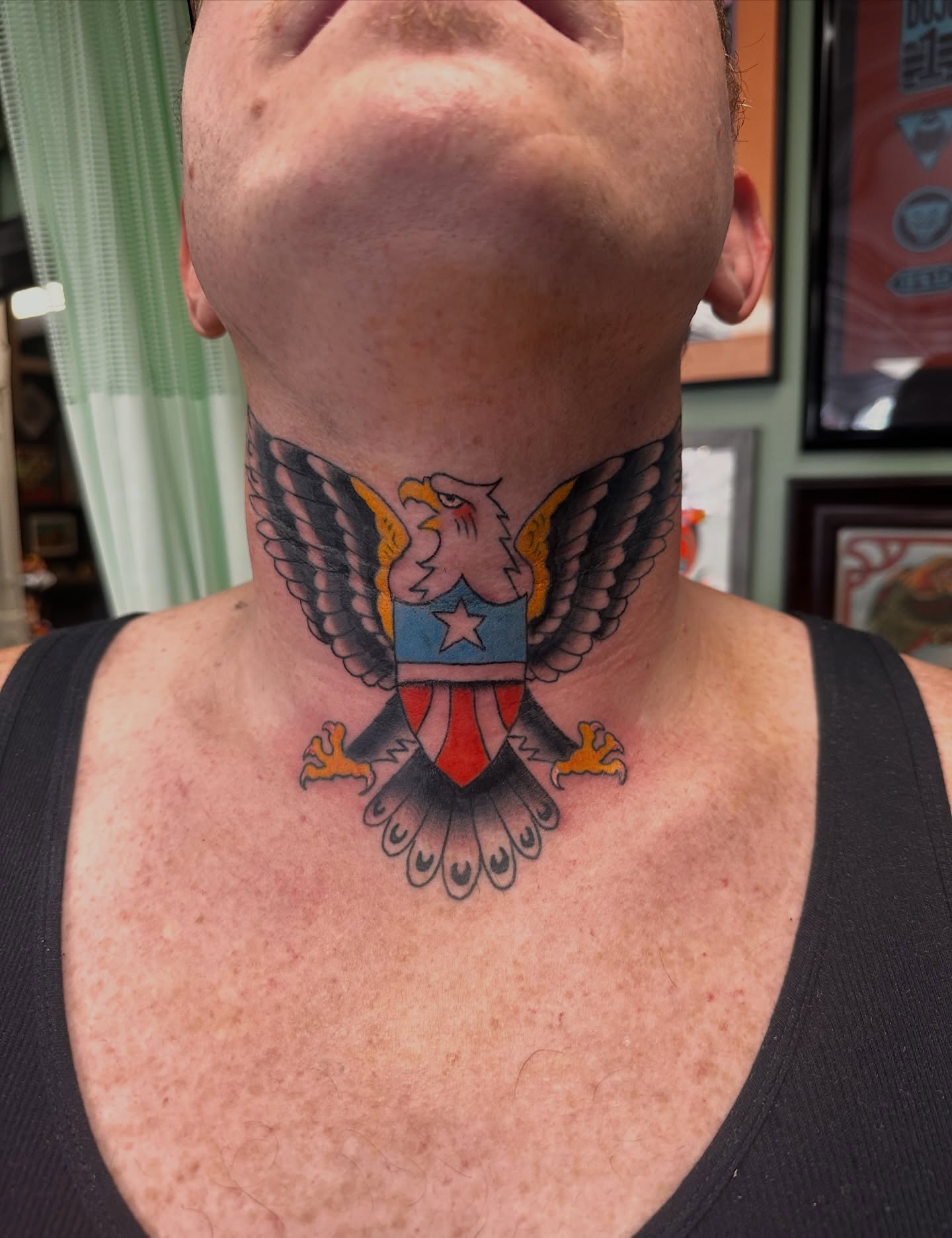 Eagle with shield American traditional tattoo on the neck by Kyle Simmons