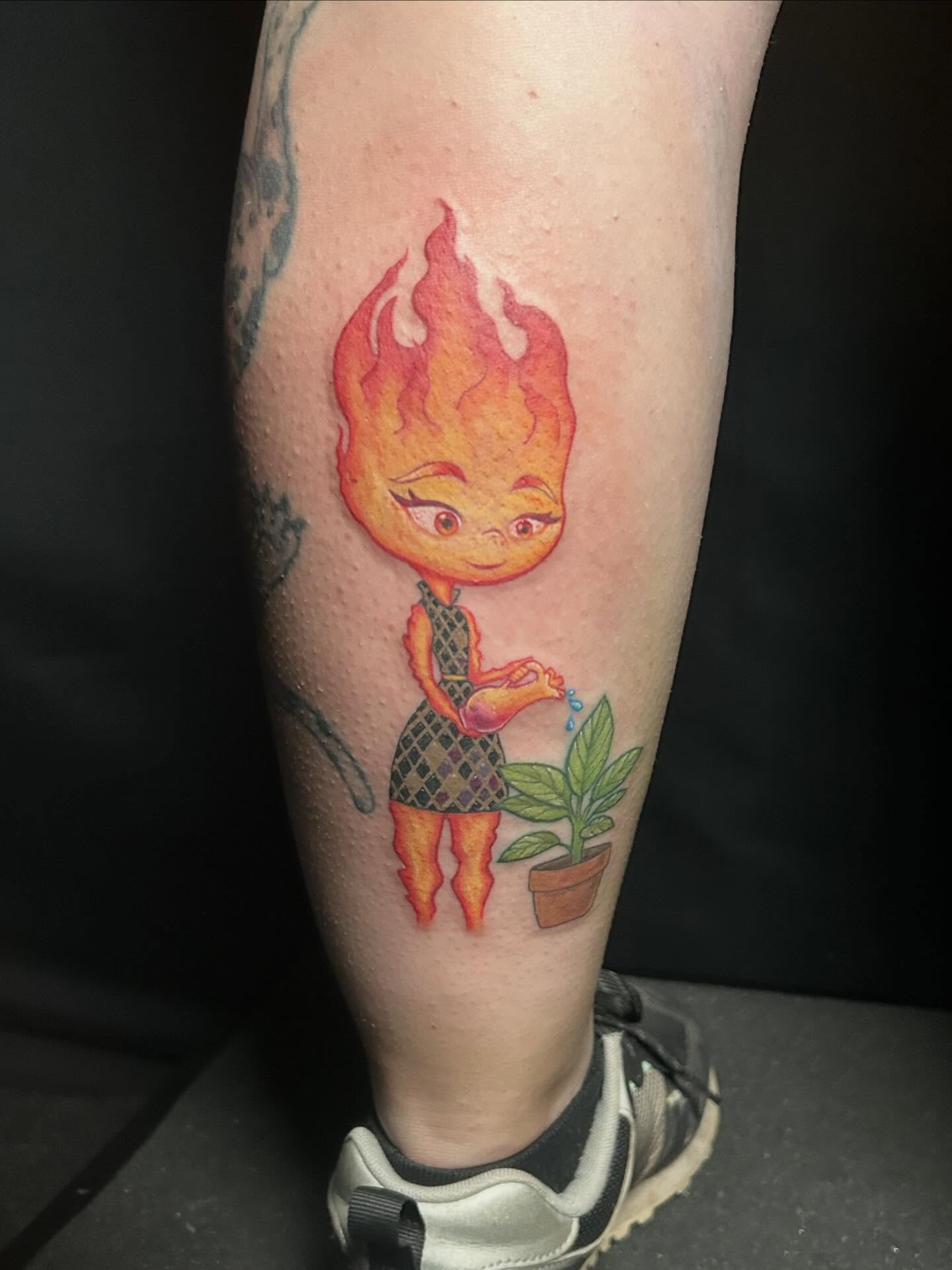 Flame girl watering plant new school tattoo on the forearm by Michigan Tattoo Artist - Emily Borneman