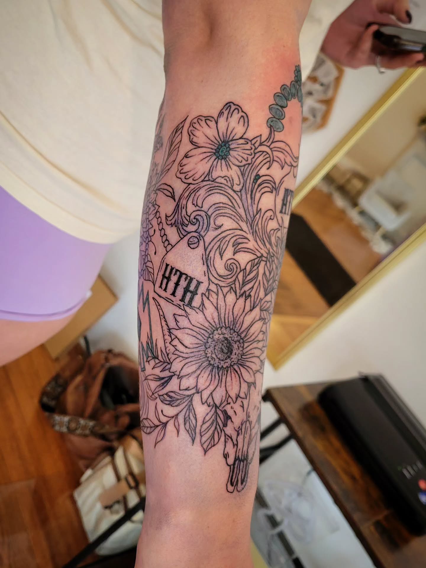 Sunflower and skull black and grey tattoo on the forearm by Solstice Tattoos by Savannah Sadler (future, Salisbury, North Carolina