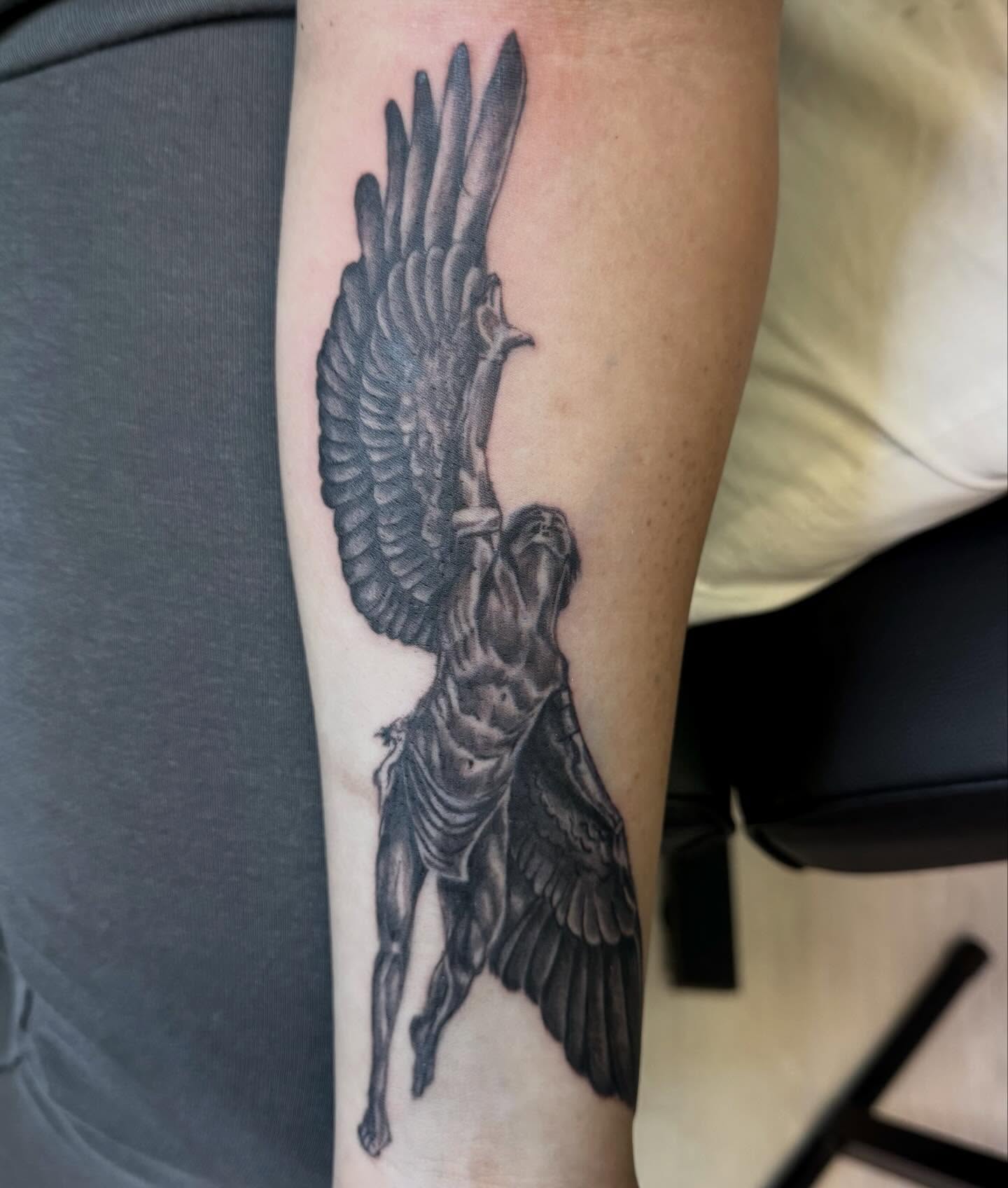 Angelic figure realism tattoo on the forearm by Gigi